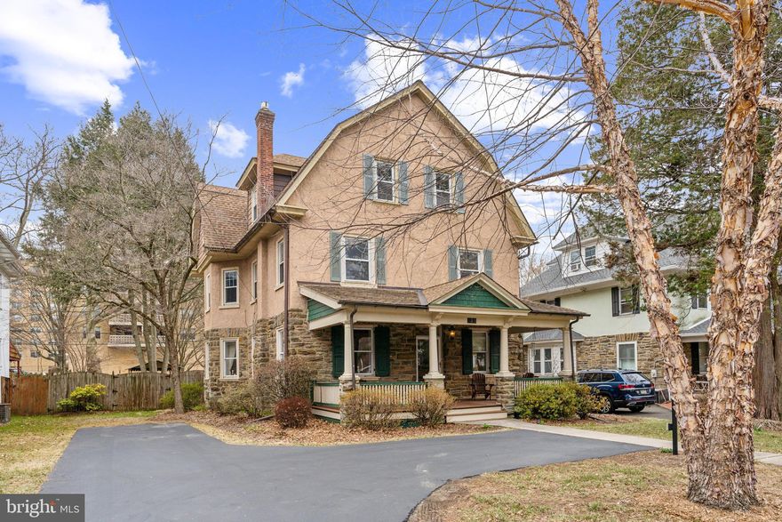 If you are looking for a very spacious home with a lot of character- and a property that is walkable to both the Jenkintown train station and shopping: 125 Township Line Road may be just the place you have been looking for!   With a total of six bedrooms and three and a half bathrooms in over 3000 square feet of living space,  this home has all the hallmarks of being lovingly maintained and updated over the years.
A charming columned front porch leads to the handsome oak front door with custom stained glass transom.  The entrance foyer is large enough to have it's own sitting area- and you will fall in love with the beautifully restored paneled oak staircase and pressed tin ceiling.  To the left of the foyer is a large living room with beautiful hardwood floors and a gas fireplace with stained oak mantel.  Enter the dining room through large original pocket doors: with  a sunny bay windowed area and reproduction William Morris wallpaper, the dining room is spacious enough for even the largest of holiday gatherings.  A very charming powder room is almost hidden under the main staircase and is perfect for guests. The kitchen with stainless steel appliances and a separate breakfast or tv room with a full bath and access to the back yard complete the main floor.  The second floor offers three spacious bedrooms and a full hall bathroom with tub.  The third  floor has just been renovated and affords three more bedrooms and a brand new bathroom with marble flooring and large walk-in shower- this level could also make a fantastic primary suite of rooms with an office/exercise room and walk in closets.   Other important items to mention:  the house was completely rewired with a new 200amp electrical panel in 2023, the central air and forced hot air heating systems were replaced in 2018.  main roof replaced in 2018,  Large dry basement with raised platform for model trains (or maybe children's stage performances?)  The back yard is fully fenced with a charming stone wall at the rear, fountain, storage shed, covered pergola, and lots of mature plantings.   There are almost too many interesting qualities in this home to list - it must be seen in person to be fully appreciated.