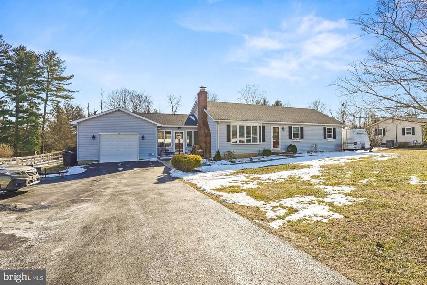 Welcome home! Two full kitchens, Five bedrooms, three full bathrooms and an additional family room means plenty of room for everyone. Open floor plan with gorgeous, renovated kitchen with plenty of table space. Generous living room with gleaming wood floors large bay window and a cozy wood burning fireplace.  Custom barn doors reveal a generous master suite with soaring ceilings that is bursting with natural light. Three additional bedrooms on the main level are expansive, the third boasts custom shelving and built ins. The lower level is completely finished with a large family room and bar, fully updated kitchen, large bath with soaking tub and custom tile. The spacious lower level bedroom has additional egress via the walk out stairs. Large fenced yard with secure storage.