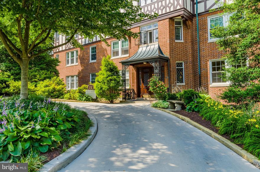 Top Floor Sun Filled Corner Unit with Large Balcony in this beautiful Tuscany/Canterbury neighborhood. Very Large Bedrooms (1 w/ private bathroom) Washer hook up, updated electric, in a Gorgeous Tudor Building with Secured Entry. Walk the landscaped grounds with mature trees/ flowers.  Elevator to top 5th floor condo.  Walk to Johns Hopkins University. Deeded Garage Parking Space, 1,249 SQ FT.