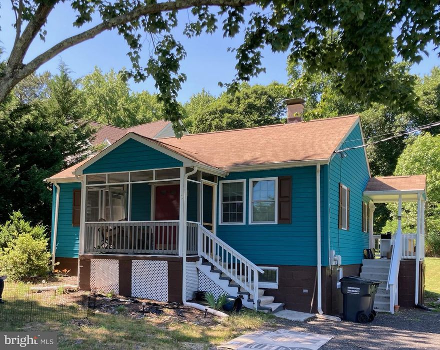 *****PRICE REDUCED*****
Welcome to this charming 2-bedroom, 1-bath rambler set on four acres in central Calvert County, freshly updated and move-in ready. Inside, you’ll find brand-new engineered hardwood floors and fresh paint throughout, creating a bright and inviting feel. The kitchen shines with modern stainless steel appliances and a crisp, updated design, while the bathroom was also remodeled in 2019, along with the installation of energy-efficient windows and a new HVAC system for added comfort. The unfinished basement has been improved with drain tiles and a sump pump for extra peace of mind.
Step outside to enjoy the covered front and side porches or take in the expansive backyard, offering plenty of space to relax, entertain, or garden. Directly across the street, the American Chestnut Land Trust and Parkers Creek Wildlife Management area together offer over 1500 acres of preserved land and trails, perfect for nature lovers.
This home is ideally located just minutes from shopping, restaurants, a movie theater, bowling, beaches, and more, with easy access to major destinations like Calvert Cliffs, NAVAIR, Annapolis, Old Town Alexandria, Washington, D.C., and BWI Airport. If you’re seeking a peaceful, updated retreat close to both nature and convenience, this Calvert County gem is ready for you.

Please note, the property plat is available for review, and the barn seen in some views is not part of this parcel.