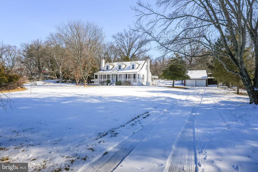 Sited on a picturesque 2.5-acre lot in the heart of Loudoun Valley , this charming Cape Cod home combines classic character with modern upgrades. Featuring 3 bedrooms and 2 bathrooms, this property is a serene retreat with no shortage of inviting spaces. The front porch welcomes you to relax and enjoy the peaceful surroundings, while inside, gleaming hardwood floors, an abundance of natural light, and freshly painted walls create a warm and inviting atmosphere. The spacious living room boasts a cozy fireplace flanked by built-in shelves, perfect for unwinding after a long day. The remodeled kitchen is a chef’s dream with granite countertops, stainless steel appliances, a center island with a gas cooktop, and elegant pendant lighting, seamlessly flowing into the dining area, ideal for entertaining. Upstairs, the bright and airy bedrooms offer comfort and charm, while the updated bathrooms showcase modern fixtures and stylish finishes. The lower level features a finished basement with recessed lighting, providing versatile space for a recreation room, home office, or gym. Outdoors, the expansive yard with mature trees is perfect for gardening, recreation, or simply enjoying nature. The property also includes a screened pavilion, ideal for summer evenings, and a detached workshop or storage area. Conveniently located minutes from Purcellville’s historic downtown, award-winning wineries, and outdoor recreation, this home offers the perfect blend of privacy and convenience. Don’t miss the opportunity to make this property your own—schedule a private tour today!