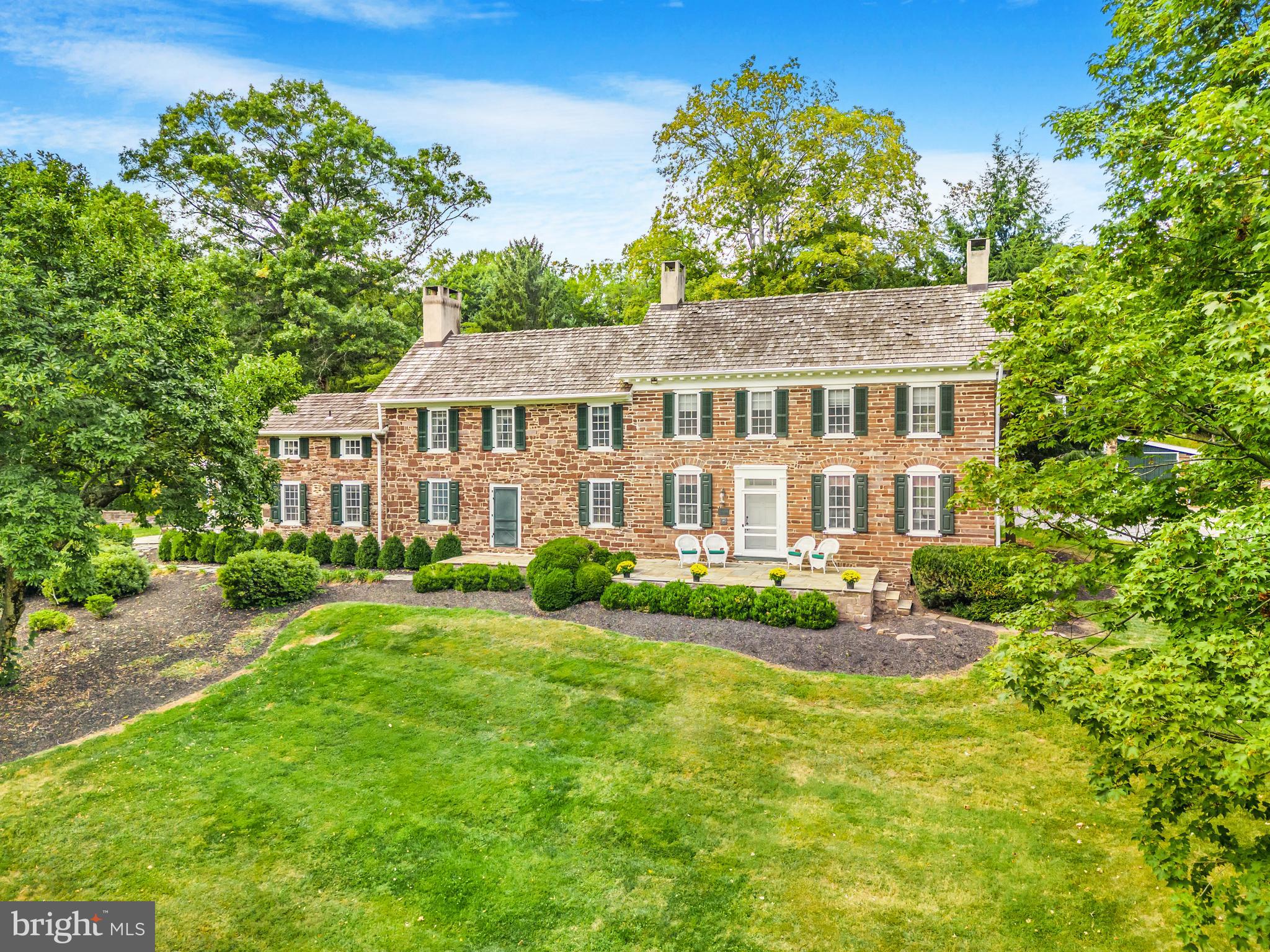 Built in the year 1752, this remarkable estate holds a distinguished place on the National Register of Historic Places and historically functioned as a medical facility for the troops of George Washington during the Revolutionary War. The property includes a charming two-bedroom carriage house, a picturesque natural swimming pond that enhances the landscape, and a tennis court perfect for leisurely pursuits. Additionally, the original barn has been cleverly transformed to serve dual purposes as both a pool house and a garage. Surrounded by vibrant gardens, sturdy trees, and a sprawling meadow, this residence offers an enchanting blend of historical importance and natural charm.