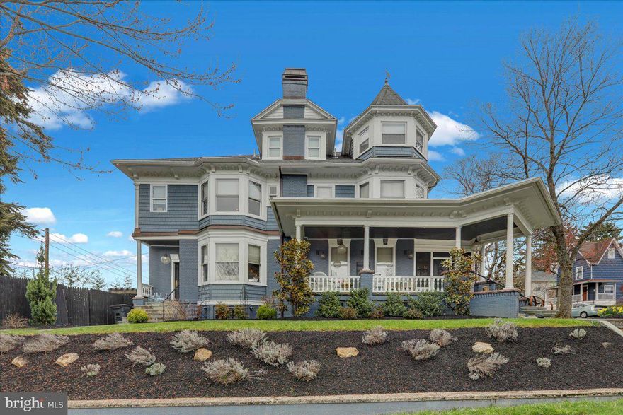 Grand Wyomissing Victorian with Outdoor Entertaining Oasis     

Set on a corner lot, in the heart of Wyomissing, just steps from the school, park system, playgrounds, and Penn Avenue shops, this three-story Victorian blends classic architecture and finished indoor–outdoor living.  

From the street, the home makes a stately first impression with brick and shake siding, copper flashing, detailed trim, and three covered porches with slate steps — including a gracious front porch with Mahogany flooring, pillars, iron handrails, and wood ceiling.  

Enter immediately into the lovely sunroom, where replacement windows fill the space with light and a beamed ceiling and hardwood floors add rich character. Then through the gorgeous front door framed by intricate windows, the main foyer is elevated by crown molding, tall windows with wood trim, and rich woodwork on the staircase.  

Hardwood naturally flows into the living room, which is anchored by a corner brick gas fireplace with marble base, crown molding, and decorative glass transoms above the windows to the sunroom, and sliding wood doors to the dining area.  

A combined dining room and kitchen forms the heart of the main level, designed for serious cooking and modern hosting. A massive eat-in island with Versiglia quartz with matching built-in serving bar, floor-to-ceiling subway tile, built-in shelves, and a large bay window in the dining area create a restaurant-inspired setting for everyday meals and entertaining.  

Additional upgrades include a commercial 6-burner gas stove with grill and double oven, hammered brass hood with upgraded ventilation, brass pot filler, butcher block countertops, farm sink and built-in refrigerator and dishwasher with matching panels.   

A tucked-away coffee bar/pantry with quartz top streamlines daily routines, and a separate mudroom with matching cabinetry and subway tile opens into a main floor powder room with wood floors and pedestal sink.  

On the second floor, the primary bedroom offers hardwood floors, crown molding, a statement-making bay window, and a huge walk-in closet with both windows and a wall of built-ins, while the private bath features a jetted tub, tiled shower with glass surround, vanity with granite top, tile floor, built-in shelving, wainscoting, and crown molding.  

Two additional bedrooms on this level each offer hardwood floors, crown molding, and their own en-suite baths — one with tiled tub/shower, the other with a claw-foot tub.  

A walk-up third floor lives like its own private suite with hardwood floors, angled ceilings, storage closets, a turret office/sitting room, and an en-suite bath with tile floor, stall shower with glass surround, oversized vanity, and wainscoting.  

The lower level adds flexible space for recreation, fitness, or storage, along with a laundry area with a wash bin sink to keep daily life running smoothly.  

Out back, the larger corner lot opens into an expansive paver patio and walkways that create a true outdoor oasis, with a stone kitchen featuring a granite-topped counter and built-in grill, a wood pergola and stone hearth for evening gatherings, layered landscaping framed by privacy fencing, and a detached 2‑car garage with alley access and storage above.