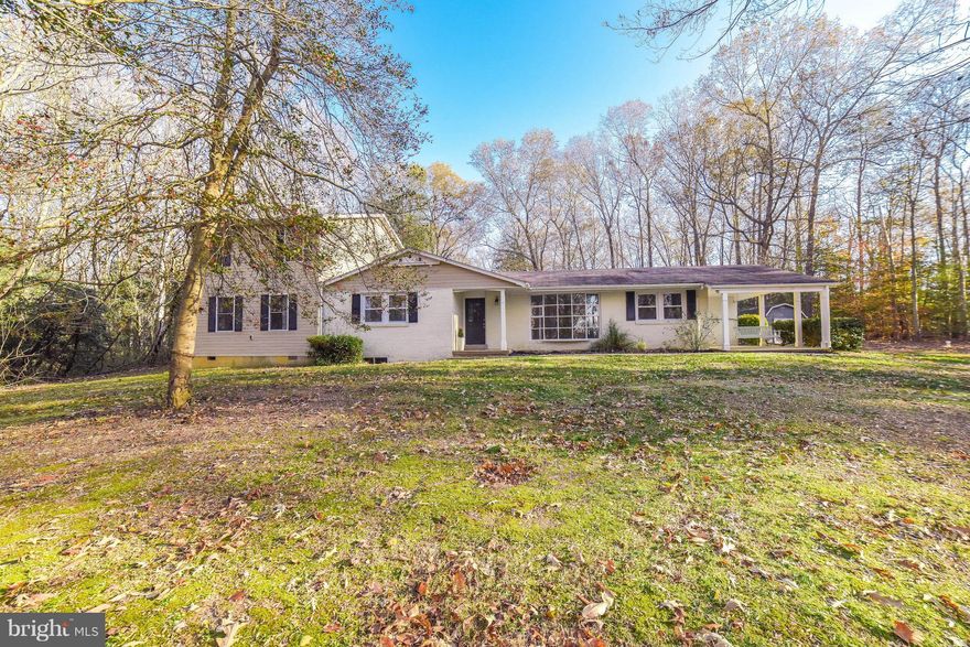 Room for everyone! 5 BR home...situated on over 6 private acres! Kitchen with stainless steel appliances, island, table space AND fireplace. Separate dining room for special occasions. Living room with bay windows for lots of natural light.  Family room perfect for entertaining. Gather/Entertain on the back patio or level backyard....perfect for BBQs. Hardwood floors throughout. Fresh paint. No HOA! Close to shopping, dining, & more...