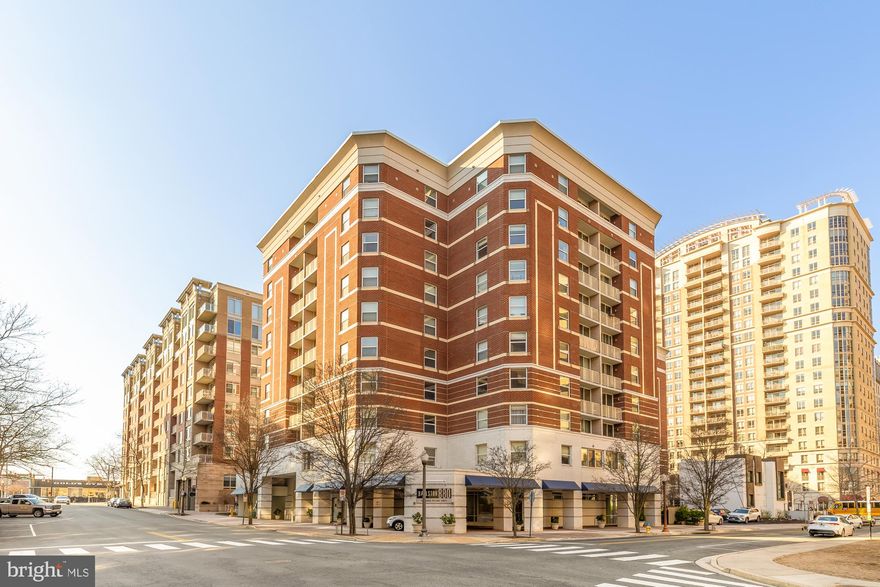 Stylish, turn-key 1-bedroom + DEN corner unit condo in the heart of Ballston!  Welcome to this one-of-a-kind condo at Ballston 880, where modern convenience meets urban sophistication in one of Arlington’s most vibrant neighborhoods.  Current owner invested over $50K in many major upgrades since purchasing the home in 2018.  The endless list includes new ceilings (popcorn ceilings removed), new energy efficient steel ductwork, HVAC replaced (2018), water heater w/ expansion tank (2023), light fixtures and hardwood flooring (carpet removed).  In-unit washer/dryer (2020).  Bathroom and kitchen renovated (2018).  Fresh paint throughout and new garbage disposal (2025).  This remarkable unit offers an ideal blend of comfort and functionality, perfect for professionals, investors, or anyone seeking a dynamic city lifestyle.
Open the front door and you'll be greeted by an open floor plan with oversized windows and abundant natural light. The updated kitchen boasts calacatta countertops, tile backsplash and new soft close cabinetry.  The den is a versatile space—ideal for a home office or guest area.
The spacious primary bedroom features a large walk-in closet w/ custom shelving.  The sleek, modern bathroom (renovated 2020) has additional built-in storage, new vanity and floor/tub tiling.  The balcony is perfect for stepping out for some fresh air.       
Enjoy resort-style amenities including a fitness center, outdoor pool, concierge service, party room, business center, conference/meeting room, theatre room, billiards room, and an outdoor courtyard with grilling stations. With Ballston and Virginia Square metro stations both just blocks away, along with top dining, shopping, and entertainment options at Ballston Quarter, the location is unbeatable.
Pet-friendly and investor-friendly! One assigned garage parking space (#318) included. Don’t miss your chance to own in one of Arlington’s most sought-after communities!