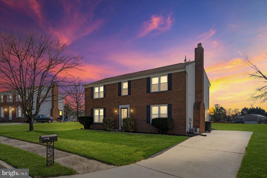 This stately 4-bedroom, 2.5-bath Colonial with a classic brick façade is set on a spacious, open lot in the highly desirable Discovery Acres community. A beautifully manicured lawn welcomes you as you approach the front entrance and step into a home designed for both comfort and functionality. The main level features formal living and dining rooms filled with natural light, gleaming wood floors, and a neutral color palette—perfect for both everyday living and entertaining. Just beyond the hallway and convenient half bath, you’ll find a bright breakfast nook, an open kitchen, and a functional laundry/mudroom. The kitchen offers ample cabinetry, an updated stove and dishwasher, and a sink perfectly positioned under a window. It flows seamlessly into the inviting family room, complete with new flooring and a cozy fireplace accented by a whitewashed brick surround. The laundry/mudroom provides direct access to the driveway, adding everyday convenience. Upstairs, the second level features three generously sized secondary bedrooms, a full hall bath with double vanity and a stylish tile accent wall, and an expansive primary suite. The primary bedroom includes a walk-in closet, an additional large closet, and a private en-suite bath with double doors, a floating vanity, and a beautifully tiled walk-in shower. The lower level offers a recreation space with new flooring and unfinished storage—ideal for a home office, gym, or future expansion. Step outside from the breakfast room to a spacious patio overlooking a large, open backyard—perfect for entertaining, relaxing, or creating your own outdoor oasis. Conveniently located near shopping, dining, and major commuter routes, this home offers the perfect blend of space, style, and location.