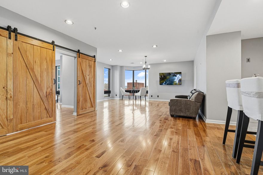 Don't miss this opportunity to own a beautiful two bedroom, two full bathroom condo at the Towers at Harbor Court. Both bedrooms are water-side, including the spacious primary suite featuring a private ensuite bath, a custom walk-in closet, and gorgeous barn doors. The thoughtfully designed layout offers comfort and privacy, perfect for relaxing or entertaining. Residents enjoy access to building amenities such as a 24/7 front desk and doorman, a boardroom/party room, a deeded parking space and storage unit. Additional perks include access to the attached hotel’s pool and fitness center through optional membership, combining convenience with resort-style living.