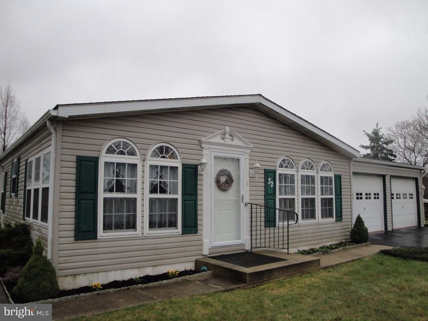 What a great opportunity to own this gorgeous mobile home in the desirable Village of Quiet Acres! Well maintained and ready for a new owner! Walk in to a spacious layout featuring a family room, large kitchen with breakfast room, dining room, living room, and a utility room with washer and dryer hook up. The master bedroom has an attached full bathroom with a double vanity and plenty of storage. Two more bedrooms plus a second full bath complete this "Leafwood" layout. Attached to this home is a two car garage, which leads into the utility room. There is also a private deck, and a storage shed in the back yard. New heat pump installed 2014, New electric range 2013, glass and grids of windows replaced 2011 & 2012. Make your appointment today!