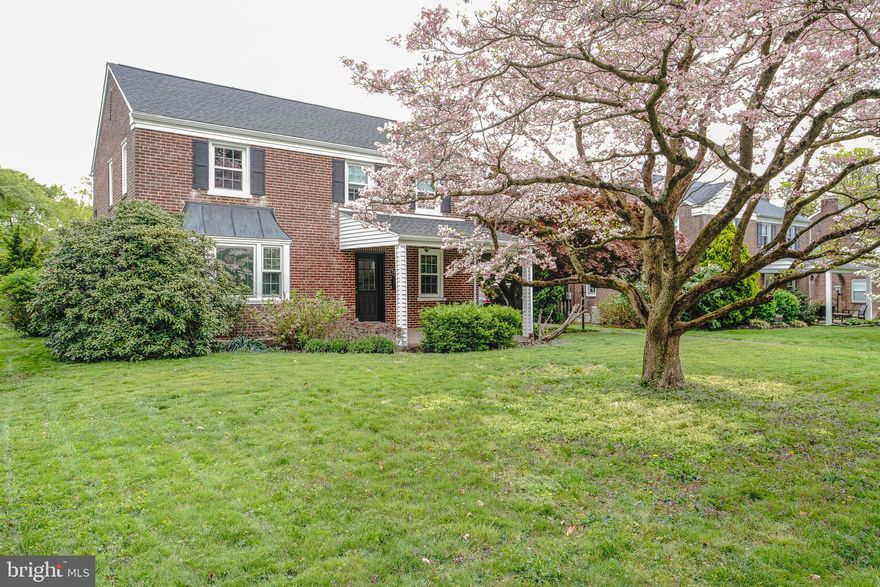 Beautiful birck colonial single  in desirable Oak Lane Manor !.   Long 3 plus car driveway and attached 1 car side garage .  Front covered patio . Formal living room with hardwood floors , brick wood burning fireplace and newer windows .  Formal dining room with hardwood flooring,chandelier, and newer windows . Modern eat in kitchen with ceramic tiled flooring , stainless steel gas range , stainless steel refrigerator , stainless steel sink , stainless steel dishwasher , granite counter tops , cherry cabinets with crown moldings . Exit from kitchen to rear covered cement porch . Lovely rear fenced level yard . Semi finished basement laundry , storage ,powder room ,  and recreation room !! . 2nd floor offers rear Primary bedroom with newer modern primary bath with stall shower , tiled floor and walls.  2nd bedroom with hardwood floors ,ceiling fan closet . 3rd bedroom with hardwood floors , closet . HVAC 2006, Newer roof . Newer windows , newer driveway . Attic storage . Close to public transportation and shopping on Cheltenham ave !!