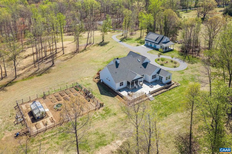 Welcome to your private eco-friendly oasis, where modern farmhouse charm meets thoughtful sustainability on 21 gently rolling acres.  Conveniently located close to top-notch health care, CHO airport, and excellent wineries, this property offers the best of both worlds. Built with durability and efficiency in mind, the home features ICF construction, geothermal heating, and an impressive 40 GPM well.  3 spring-fed streams wind their way through the land, supporting a vibrant ecosystem that includes abundant wildlife.  Thoughtfully planted riparian buffers add to the environmental stewardship and long-term beauty of the landscape, as do a bounteous garden, a mini orchard filled with fruit trees and figs, and professionally managed beehives that flourish thanks to the diverse plantings.  Inside, meticulous attention to detail shines through tall ceilings, abundant natural light, spacious rooms & a thoughtfully designed floor plan ideal for both one-level living or a growing household.  The 2,375 SF detached carriage house is perfect for hobbies or storage, w/ potential to add a kitchen and bath.  Whether you?re seeking a peaceful retreat or a working homestead, this property blends luxury living with the beauty of the natural world.,Glass Front Cabinets,White Cabinets,Wood Counter,Fireplace in Family Room