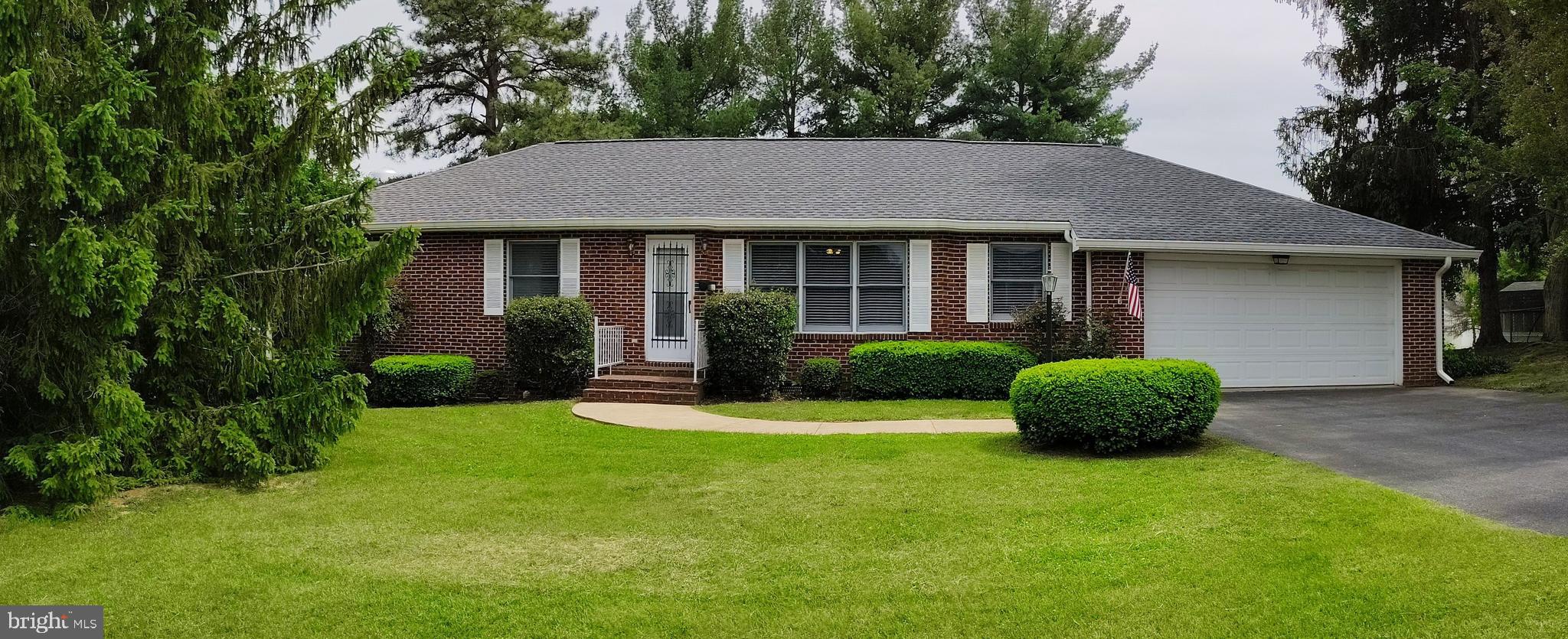 MOVE IN READY!!!! Spacious, one level living! HUGE eat-in kitchen, 22.5'x14', large bedrooms, massive formal living formal dining room combo, BRICK walled conservatory or sunroom, TREX deck, big garage, at 32'x20' with a double door entrance at the back. A separate laundry room with cabinets, and a lovely flat, landscaped lawn with mature trees. This has been a NON-smoking house! With NEW two inch blinds, some new paint, carpet and flooring, an almost-new roof, a NEW fridge and stove, you’ll agree, this house has been lovingly maintained. There are plenty of closets but there is also tons of STORAGE in the attic and even in the LARGE crawl space! The house is ready for persons using mobility equipment with a garage-to-house access ramp and wide doors for use of a mobility assistance device. The primary bath has safety bars and pull down seating. All measurements are approximations.