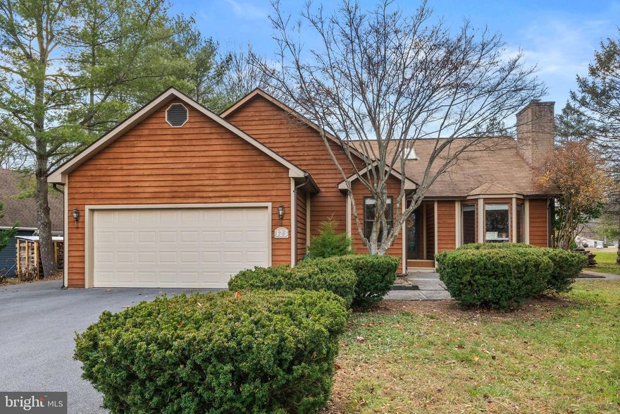 Welcome to 323 Masters Drive, a beautifully updated ranch home in the gated Lake Holiday community where thoughtful design meets everyday comfort. From the moment you enter, you’ll notice the tall ceilings and attention to detail in the custom shiplap and accent walls that add warmth and character throughout. The inviting layout flows seamlessly into a generous family room addition and a refreshed kitchen, while the primary suite offers a true retreat with a spa-inspired soaking tub and serene finishes. Two secondary bedrooms provide flexibility for family, guests, or a home office. An additional flex space offers endless possibilities to create a space that fits your life: gym, office, craft room the possibilities are endless! Outdoors, a spacious back porch overlooks open space, perfect for entertaining, unwinding at sunset, or enjoying visits from local wildlife. Whether you cozy up by the fireplace, or picking apples in the yard, this home is move-in ready yet leaves room for your personal touch. Just minutes from Winchester and commuter routes, and with access to Lake Holiday’s beaches, boating, tennis, and clubhouse, this property delivers both modern updates and a lifestyle upgrade you won’t want to miss. This home has been thoughtfully updated over the years, ensuring comfort and peace of mind from day one. The HVAC was replaced in 2019, followed by a new hot water heater in 2021. The kitchen underwent a full renovation in 2022 with Cambria quartz countertops and custom, locally-sourced walnut breakfast bar, along with a beautifully remodeled primary bathroom in 2025. Most recently, a versatile flex-space addition was completed in 2025, offering even more room to live, work, or relax.