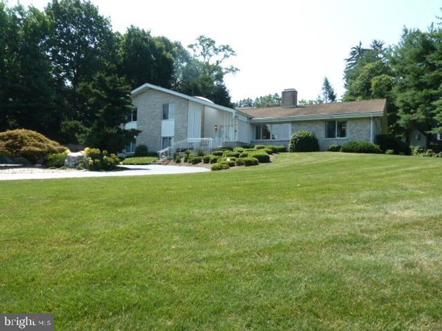 Perched atop Wyndham Hills sits this gracious home, steps from CC of York 5th tee. Perfect for entertaining, this elegant home features a formal living and dining room w/sep family/den and 3-season room. 4 bdrms including 1st floor guest suite w/full bath. The custom garage has room for 8 cars or can fit half as many and be finished for many uses.