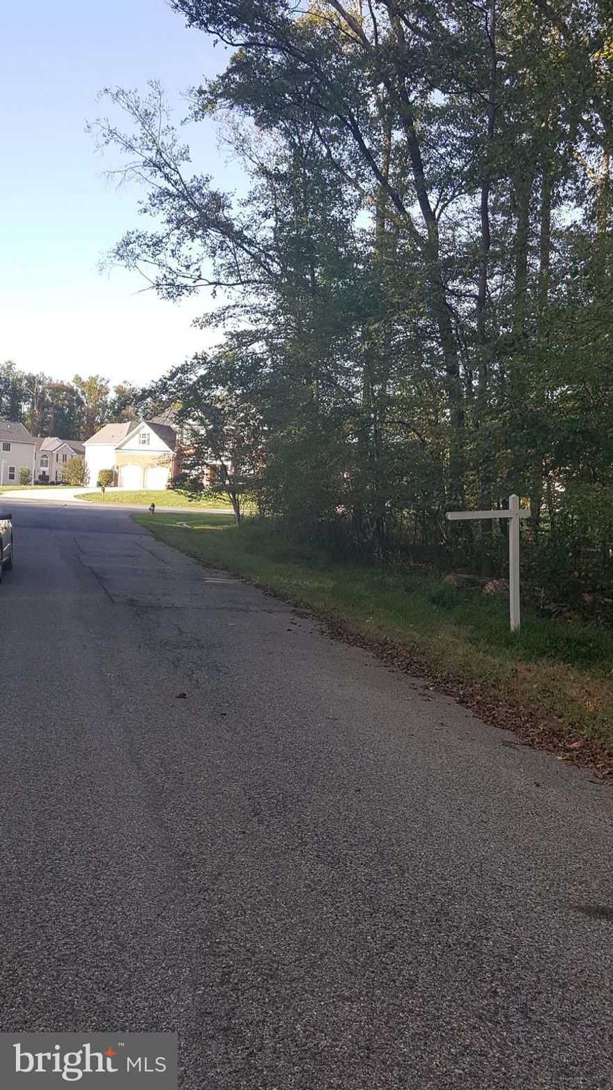 Perfectly level and nice wooded 0.844 acre (202 Ft x 185 Ft) Lot directly adjacent to a cul-de-sac in a development with relatively new large single family homes. Public sewer line in front of property. Public water available nearby (Please check with WSSC for accessibility and permit). Property lines and WSSC water and sewer lines termination points are shown in photos and documents. Lot is about half-a-block from Largo Rd (MD 202) with quick access to Largo Metro Station and Town Center, Prince George's Community College, Capital Beltway and shopping centers. Ideal Lot/location for a new home