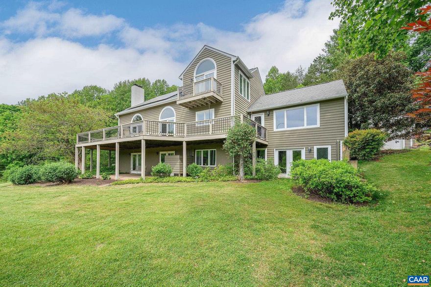 Stunning, sweeping pastoral mountain views from most vantage points is one of the highlights of this unique property. This home is nestled on the land in such a way that honors and blends with the land and was clearly thoughtfully designed. The 8.8 acres are partially wooded and also rolling & open land and is a quick drive to Charlottesville yet feels extremely private and serene. The kitchen (cherry/granite/Wolf range) connects the expansive great room with gas fireplace/built-ins. The dining room/living room open space includes: vaulted ceilings, floor to ceiling windows/doors for the amazing year-round views and tons of natural light, wood burning FP, newly refinished oak hardwood floors. In the basement level, there's a full 2nd kitchen with options for a second living space or could be all a part of the main house. Solar panels are already set up, high-speed Fiber internet in place, home has recently had extensive inspections & is ready to go. Oversized garage w/3rd bay, garden spot already arranged, local/native plantings around the property, a nature lovers dream. This parcel is also conveying with division rights for additional build sites. Truly a one-of-a-kind opportunity with unique features in every detail.,Cherry Cabinets,Granite Counter,Fireplace in Family Room