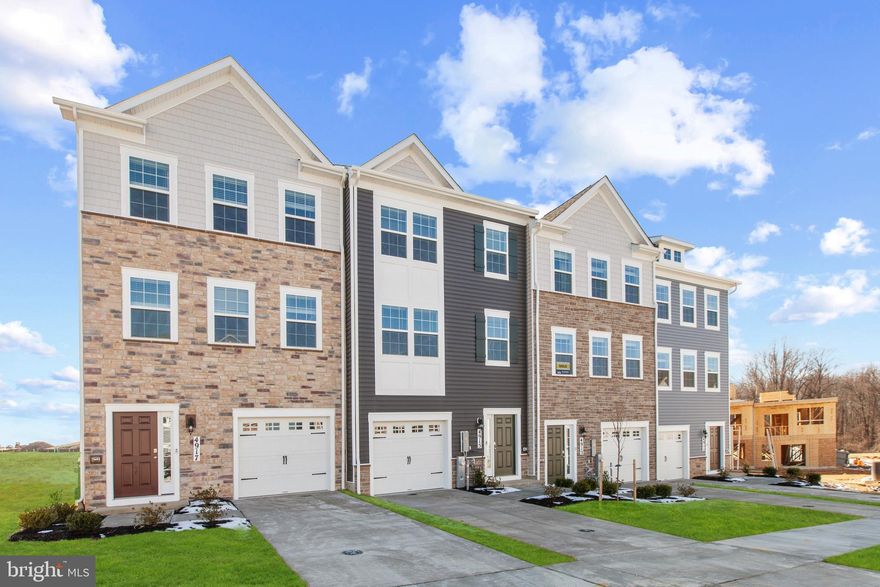 This townhome is backs to forest green tree space, conveniently near community amenities! This Lafayette townhome offers1,969 square-foot, with 3 bedrooms, 3.5 bathroom, an 12X10 DECK INCLUDED and 1 car front load garage. There is plenty of space for entertaining family and friends in your finished lower level with full bath and den leading you to backyard green space. 
 The mail level offers an open concept living area, features a rear island kitchen with Stainless Steel Whirlpool kitchen appliances with 5-burner gas range, upgraded White Panel Cabinets and Quartz Counter tops. Hard surface flooring in the lower level den and main level. The third level has a gorgeous owners suite with a large walk-in closet and features a luxury owners shower with Quartz counter tops. Two secondary bedrooms, upper level laundry, and hall bathroom with White Quartz counter tops.  This home is also equipped with smart home technology. The package includes a keyless entry, Skybell (video doorbell), programmable thermostat to adjust your temperature from your smartphone and much more. Commuting and shopping is made easy with quick access to 1-495, Route 5 and to the Washington DC area.