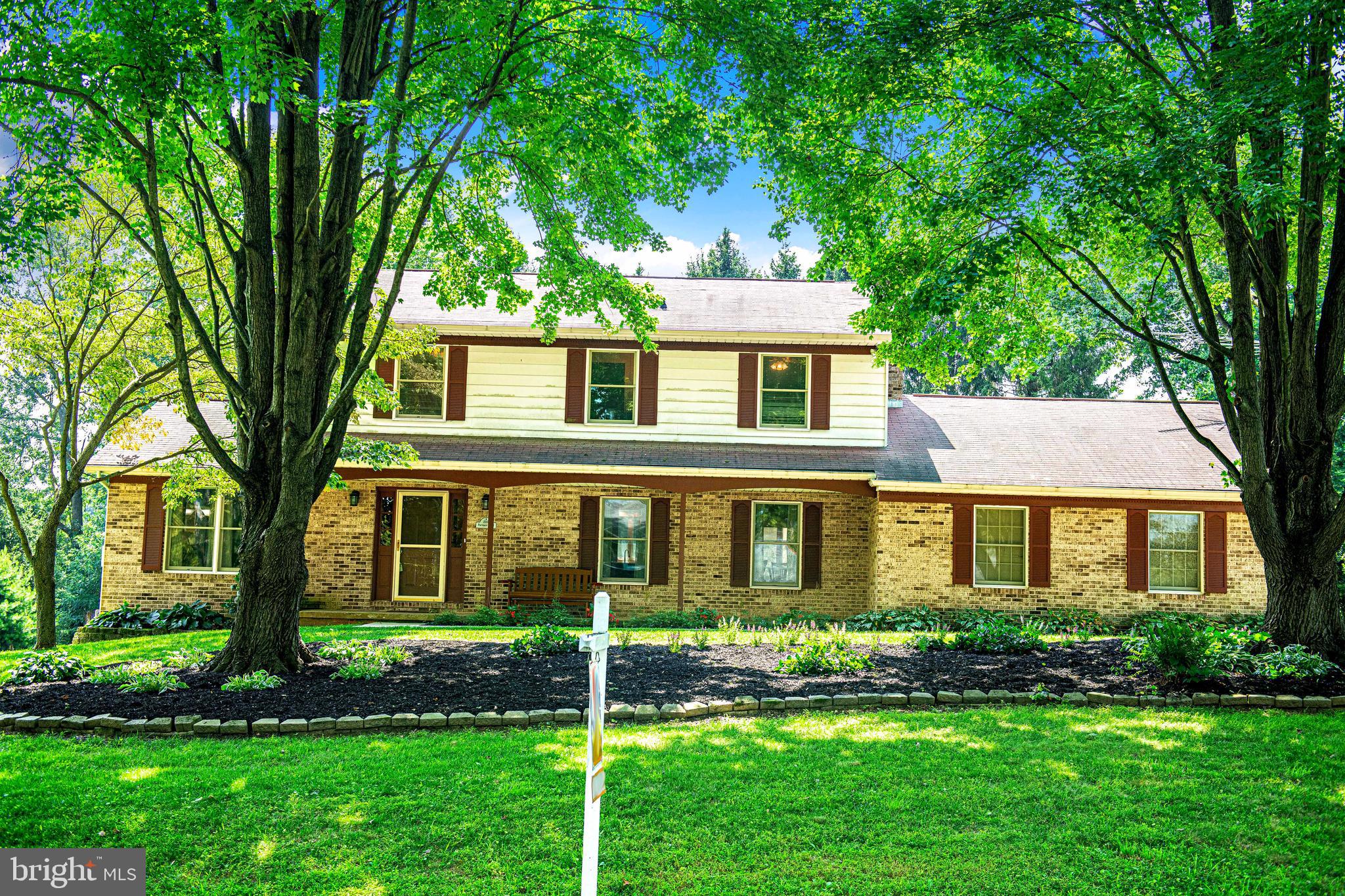 Welcome to this stunning 4-bedroom, 3.5-bath Colonial nestled on a beautifully landscaped lot and loaded with upgrades and charm. From the moment you arrive, the stone entryway and inviting curb appeal set the tone for what awaits inside. Step into a thoughtfully updated interior featuring luxury vinyl tile flooring, a spacious den/home office, and a bright open-concept layout. The heart of the home is the recently renovated kitchen, which now includes a cozy fireplace for added warmth and character. This gorgeous space also features white cabinetry topped with crown molding, a custom oversized island, tile backsplash, recessed and pendant lighting, stainless steel appliances, and plenty of table space. A new sliding glass door leads to the backyard patio—ideal for indoor-outdoor living. The cozy family room with fireplace flows directly off the kitchen, making it perfect for gatherings. A mudroom with laundry, access to the backyard, and an entrance from the 2-car garage, plus a main-level half bath, round out the first floor. Upstairs, the primary suite offers a private bath, while three additional bedrooms share a full hall bath. The upper level also features an attic with pull-down stairs and flooring in the attic for storage. The partially finished basement includes a large rec/family room with chair rail molding, recessed lighting, storage under the stairs, and walk-up access to the rear yard. There’s also a workshop area ready for your tools and projects. Out back, enjoy the peaceful and private yard featuring a covered patio with a ceiling fan, a storage shed, and lush landscaping—perfect for relaxing or entertaining. Additional features include leased solar panels for energy savings and long-term value. This home truly checks every box—spacious, stylish, functional, and move-in ready!