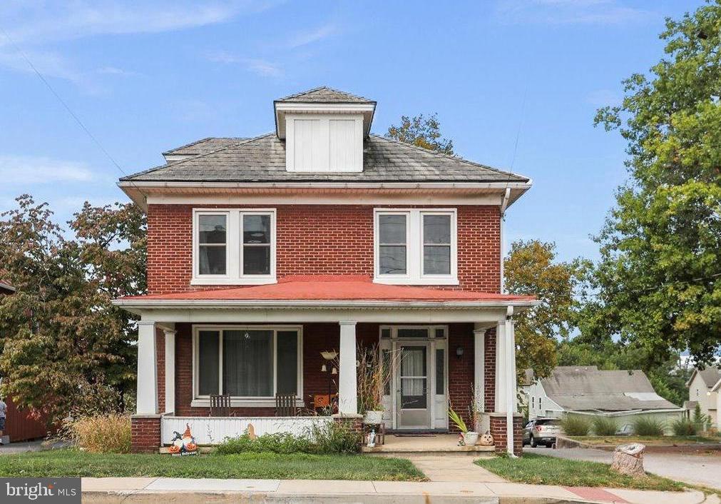This charming brick home offers 4 generously sized bedrooms and is conveniently located close to shopping, dining, and other amenities. Relax on the inviting front porch with its durable concrete floor—perfect for unwinding after a long day. Out back, enjoy a lovely yard ideal for outdoor gatherings, gardening, or play. A single-car garage provides both parking and extra storage space. The home also comes with several valuable updates: The previous owner disclosed that the boiler was replaced in 2018, windows were updated in 2019, three mini-split systems were installed in 2020. Anew gas hot water heater was added in 2025. With its solid construction, thoughtful improvements, and welcoming spaces, this home is move-in ready and waiting for its next chapter.