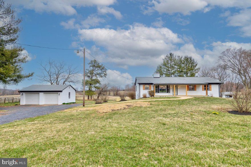 Want the rural lifestyle without giving up convenience and creature comforts? Come home to 43458 Bloomfield Rd where Privacy, Charm & Modern Comfort are combined within a renovated Countryside retreat with unmatched craftsmanship!

Welcome to the rolling countryside of Loudoun County where this renovated raised rambler delivers the perfect blend of tranquil living and modern convenience. Enjoy peace of mind knowing the land around you is protected by conservation easements - hello, forever views and peaceful surroundings. And yet, with Purcellville, Winchester, and Leesburg just minutes away, you’re never too far from a great meal, shopping, medical care or a convenient commuter route.

From the moment you pull up, this home radiates warmth and character. A covered front porch welcomes you, setting the tone for where classic charm meets fresh, modern updates. Sitting on 1.25 acres, this property is a haven for anyone who loves outdoor living—whether that means summer barbecues, gardening, outdoor play  or simply grounding in nature. Plus, with a detached two-car garage and an old garden shed ( AS IS), you’ll have plenty of storage for all your tools, toys, and treasures. 

Inside and out, the transformation is nothing short of spectacular, thanks to the masterful craftsmanship and flair for design and style of Yesterday’s Carpentry, a highly respected local builder and home remodeler known for their meticulous attention to detail and pride of workmanship.  Every element of this renovation was executed with precision, practicality and aesthetics; blending the home’s original charm with modern-day desires. Walls were taken down to the studs to create the desirable open concept that everyone is wanting, while the new doors, wood shutters, front porch posts, windows, and gutters add a touch of timeless appeal.

As you enter the home, you will immediately feel that something very special awaits. The main level features a seamless combination of brand new and newly refinished original hardwood floors which anchor an inviting breakfast room and living room- both centered around a cozy, wood-burning fireplace—the perfect place to unwind while taking in the views. The kitchen is a showstopper;  boasting custom color cabinetry, luxurious Taj Mahal quartzite countertops, stainless steel appliances, and recessed lighting galore.

Down the hall, you’ll find three comfortable bedrooms and two brand-new bathrooms, offering restful retreats at the end of the day. And let’s not forget the brand-new deck, an ideal space for morning coffee, evening cocktails, and everything in between.

Downstairs, the fully finished walkout basement is where the fun continues.   A massive rec room with plush carpeting,  a bonus room, a third full bath, and a finished laundry room create a space that’s as functional as it is inviting. There’s also a small unfinished storage/utility room for all those “I’ll get to it later” items. 

Modern upgrades include a brand-new dual-fuel HVAC system (electric + propane), a newer septic system (2019), and a larger, upgraded electrical panel box (2024)—because comfort and efficiency should never be compromised.

Every detail in this home - from the seamless blend of old and new materials with the modern touch of black accents to the thoughtfully designed layout that maximizes both beauty and function speaks to the fact that this is more than just a renovation; it’s a revival, honoring the home’s original character while elevating it to meet today’s modern standards.

34358 Bloomfield Rd is the perfect marriage of country charm and modern convenience, where you can enjoy peace, privacy, and protected surroundings—all while being just minutes from restaurants, shopping, and commuter routes.

So, if you’ve been dreaming of a home that’s as timeless as it is stylish, as serene as it is convenient, and as charming as it is fresh—this is it. Welcome home!