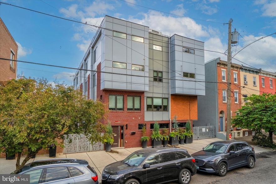 Approximately 7 years remaining on the tax abatement. Don't overlook this exquisite 3-bed, 5-bath (3 full, 2 half) residence nestled in the heart of Fairmount! This exceptional home stands out in a league of its own, boasting an array of premium features.

No expense was spared in elevating this home to the pinnacle of luxury. As you enter the foyer adorned with exquisite hardwood floors and decorative marble accents that extend throughout the house, you'll find a convenient powder room and access to the garage. From here, you can either descend into the finished basement, complete with heated floors, or ascend to the main living area.

The main floor offers a seamless flow from the living room, dining room, and kitchen. The kitchen is a chef's dream, equipped with top-of-the-line stainless steel appliances, a dual-oven, cooktop, ample cabinetry, and elegant marble countertops.

On the third floor, you'll discover two generously-sized bedrooms, each with its own ensuite bathroom and multiple walk-in closets. A well-appointed laundry room completes this level.

The fourth and final floor houses the expansive primary bedroom, featuring two walk-in closets and large windows that bathe the room in natural light. The ensuite bathroom is a haven of luxury, showcasing a standing glass shower, dual vanity, and a modern soaking tub. Above the primary bedroom, you'll find an expansive roof deck with breathtaking views of Center City. The deck includes an owner-upgraded outdoor kitchen and garden, making it the ideal outdoor setting for hosting guests on beautiful summer days.

This location is exceptionally convenient, just minutes away from essential amenities, including public transit, Whole Foods, an array of restaurants, cafes, and more. Opportunities like this are rare and in high demand, so don't delay. Contact us today to schedule a showing of this exceptional property!