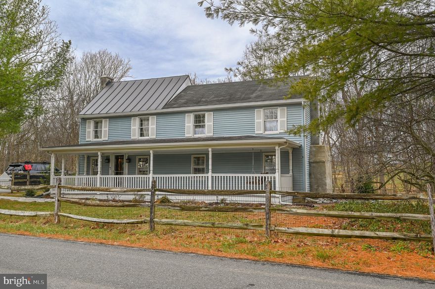This historic home features several unique features. Originally built around 1857, sections were added later to make this a one-of-a-kind home with many of the rooms having exposed original log walls and beams ceilings!  Three (3) bedrooms, with the primary bedroom having access to a balcony to enjoy the beautiful view. Bedroom #2 is upstairs (has 6 ft. ceilings), and bedroom #3 is on the 1st floor, two full bathrooms. A formal living room with hard wood floors and a decorative non-functional brick fireplace with mantle. A spacious, updated kitchen with canned lighting, Corian counter tops, center island with black stovetop, black wall oven and built in black microwave. The refrigerator and the dishwasher are stainless-steel appliances. Off the kitchen is a dining room featuring a stone fireplace with a wood-burning insert. This room leads out to a lovely covered deck, perfect for entertaining or relaxing.

Additional features include wood and deluxe laminate flooring throughout the house, a large inviting covered front porch with a swing, and a floored attic bonus room that can be used as a photo lab, playroom, craft room, or simply for extra storage.  The sellers recently installed a whole house water filtration system with UV & salt-free water conditioner!

All of this is situated on one acre of unrestricted land, which is partially fenced and includes a storage shed. The property is conveniently located close to Route 9 bypass, the VA Medical Center, and the Leetown Fish Hatchery in Jefferson County, WV.  Home is a short 15 minute drive to Shepherdstown, WV. This house is a must-see!