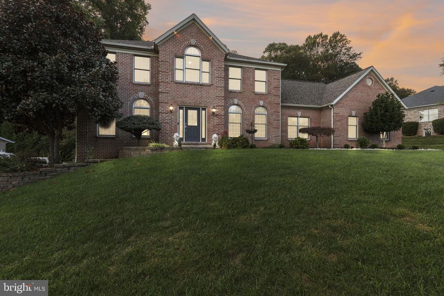 This 5-bedroom, 3.5-bath Colonial in the Cedarday community offers over 4,000  square feet of finished living space across three levels on a half-acre lot. The main level opens with a welcoming foyer flanked by formal living and dining rooms. The kitchen is thoughtfully designed with granite counters, stainless steel appliances, generous cabinet storage, and an extended breakfast counter with seating. Just beyond, a breakfast nook sits between the kitchen and family room, creating a seamless flow for casual dining and gatherings. The family room is anchored by a stone fireplace, offering a warm and inviting space. A main-level bedroom provides flexible living, while a powder room and laundry with outside access add convenience. Upstairs, the spacious primary suite includes a walk-in closet and a private bath with dual vanities, soaking tub, and separate shower. Three additional bedrooms and a full hall bath complete the upper level. The fully finished lower level offers a recreation room, family room, and game room for endless options to relax or entertain. A bonus room, currently staged as a bedroom, along with a full bath and utility room, provide flexibility and function. Walkout access leads directly to the backyard. Outdoor living includes a wide deck overlooking the yard, while a side-entry two-car garage and extended driveway provide everyday ease.