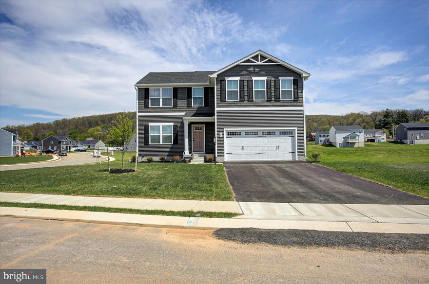 Welcome to 95 Leland way & SUMMERFIELD  one of Hanover, PA's beautiful and progressive neighborhoods! MOVE-IN READY and better than new, this beautifully completed home offers the rare chance to enjoy brand‑new construction **without the wait**!! Thoughtfully upgraded throughout, it features 4 spacious bedrooms, 3.5 baths, a main‑floor office, and an inviting upper‑level loft that adds flexible living space, on a .51 acres lot! The kitchen shines with upgraded mocha cabinetry, stylish subway tile backsplash, quartz counter tops and enhanced appliances (WOW!!) Open concept living room has plenty of space and transitions seamlessly into the kitchen/dining area and then into the office/den area. All appliances convey with the sale for true turnkey ease. Upper level continues this amazing floor plan. Offerings include 4 spacious bedrooms, separate laundry room, open loft area and a great hall full bath! Spacious primary suite has two (2!!) walk in closets, custom draperies and blinds, plus a full bath. All bedrooms have ample closet space and a great layout. The FULLY FINISHED walk‑out basement—with a large rec area and full bath—creates the perfect space for guests or extended living. Flex space in the lower level gives freedom for all your activities! Movie night, Craft area, Guest suite, or just a room to spread out  this home has it all. An attached 2‑car garage with opener adds storage and practicality. With its modern finishes, functional layout, and move‑in‑ready appeal, this home blends comfort, style, and convenience in one impressive package. Nearby shopping and amenities offer so much for a modern lifestyle you have to take a look! Commuter ranges in all directions have easy access. Not too far from Historic Gettysburg and much to do on weekends and days-off! Washington, DC &Baltimore, MD only 1.5hrs.  Take a look at this ready home! Showings begin Thursday, April 16th  schedule your private tour!