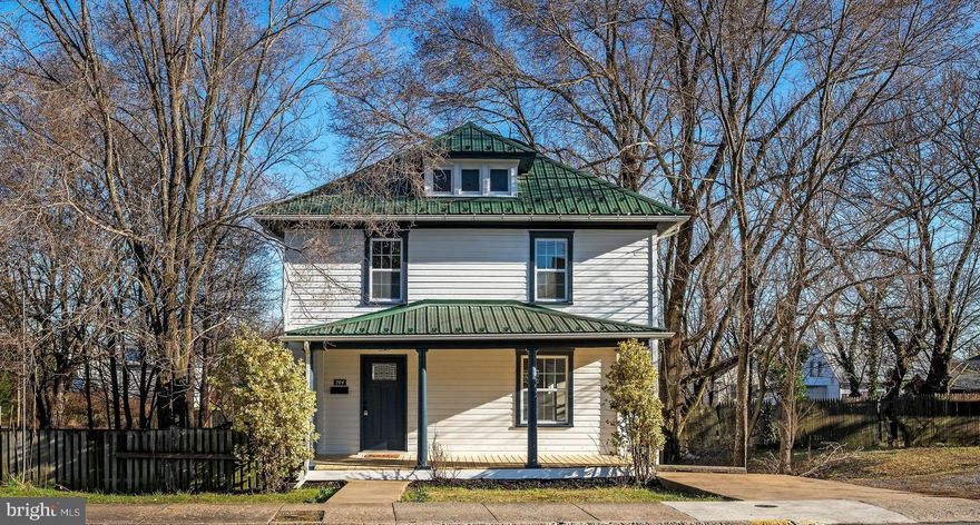 This fully renovated 3 bedroom 2.5 bath home with hardwood floors throughout, situated on an oversized lot is ready for you!  This home features a brand-new primary suite with an oversized ensuite bath- soaking tub and shower - on the second floor.  Two additional bedrooms share the updated hall bath.  On the main level, an updated kitchen with granite counters, updated cabinetry, and stainless-steel appliances has its own pantry.  The living and dining room walk out to a large deck, overlooking the partially fenced backyard with alley-access parking.  A new heat pump was installed in 2024 and provides efficient central heating and cooling.  The metal roof was replaced in the last 8 years, so it should have a long life ahead of it.  This house is move-in ready and lovingly updated unlike anything of this vintage.  It is truly a must-see!