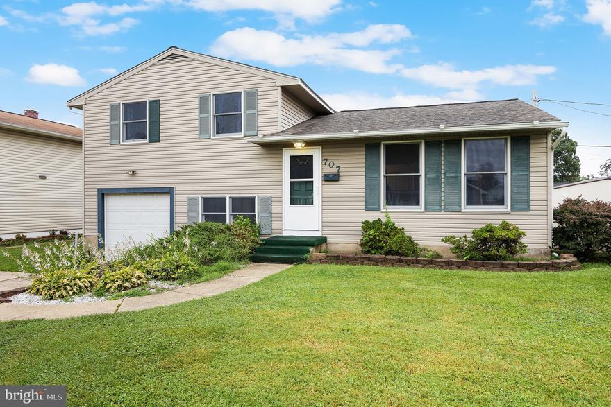 Welcome to your dream home in the desirable Munroe Gardens community—a perfect blend of classic charm and modern upgrades! This beautifully maintained split-level residence boasts three spacious bedrooms and the highlight is a fully updated upper-level bathroom featuring an OVE Decors Saga Smart Bidet and a luxurious 2 person Ariel shower system with steam, rainfall features, body jets, and dual seating for a true spa experience. Rich hardwood floors grace both the main and upper levels, while carpeting enhances the lower level. 
The open-concept kitchen is a showstopper, outfitted with solid cherry wood cabinetry, a brand new dishwasher, and a convenient island that’s perfect for meal preparation or casual dining. The adjoining dining area overlooks a composite deck, ideal for entertaining guests or enjoying your morning coffee.
Downstairs, the versatile lower level offers endless possibilities—use it as a family room, playroom, office, or whatever suits your needs. This area also includes a combined full bath and laundry equipped with a shower stall, and provides direct access to the attached one-car garage, which features sliding doors leading to the spacious backyard.
Step outside to discover a spacious, fully fenced backyard with a handy storage shed and two parking pads out front for added convenience. There’s no ground rent, and the location can’t be beat—just moments from BWI, Baltimore, Annapolis, and DC, as well as shopping and restaurants.
Don’t miss your opportunity to call this exceptional property your new home—schedule your tour today of this split level!  CINCH HOME WARRANTY ! Home is priced to reflect any needed improvements.