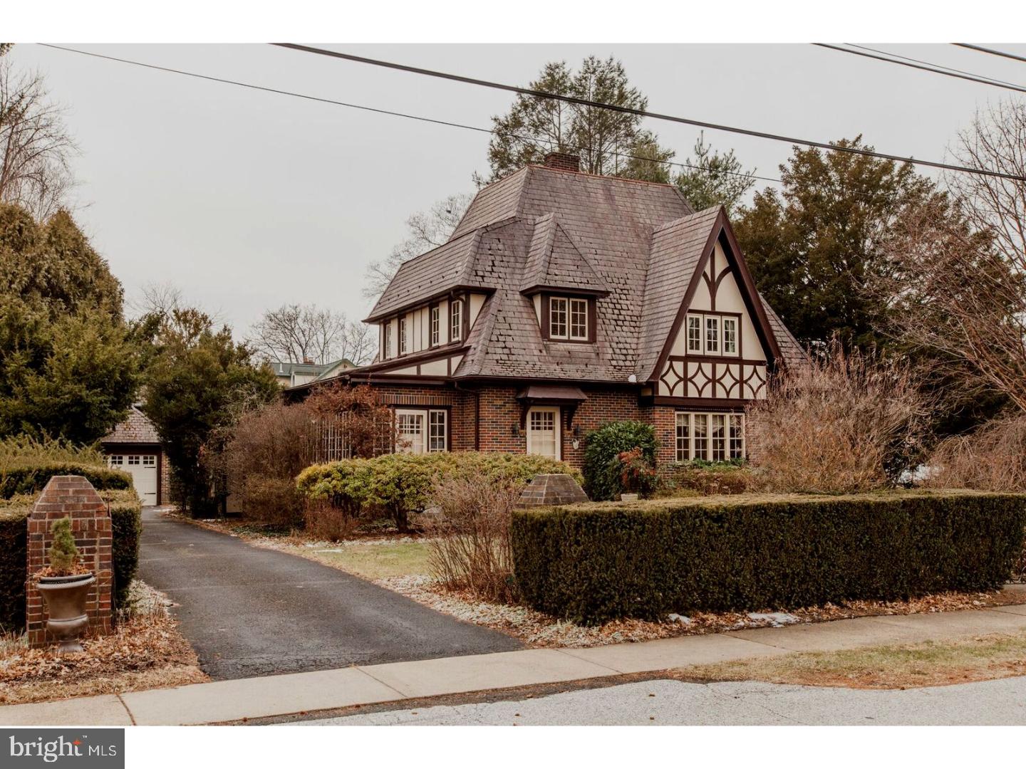 The house you have been waiting for, in the location you have been wishing for. This unique Tudor Style full brick home was definitely worth the wait. Lush landscaping and gardens welcome you. The backyard is something out of The Enchanted Garden with specimen trees, rose bushes and plantings to delight your inner gardener. The brick Tudor Style 2 car detached garage offers easy access to the family room entrance of the home. Enter into a beautifully appointed home that offers hardwood floors in the living room, crown molding, a brick gas fireplace and a walk in window. Entertain guests in the spacious dining room, with beautiful hardwood floors, crown molding, french doors with an archway that lead out to a beautiful custom patio. The updated kitchen offers 42 inch cabinets,a new built in KitchenAid Stainless Steel Refrigerator, a newer microwave and dishwasher, along with Corian countertops. The sunroom offers custom built in cabinetry, indirect lighting, a wall of windows, an entrance to the front of the property and step down into the family room addition. Relax in the generous sized family room with its gas fireplace, quarry tile floor, and an entrance to the rear yard. Laundry room is conveniently located off the kitchen. The upstairs will delight you with the newer hall bath, offering a granite sink and soaking tub and an oversized ceramic tile shower with seamless glass doors. Second floor windows have been replaced in the two larger bedrooms. The master bedroom offers hardwood floors, a walk in window, and a doorway out to a small patio to enjoy your morning coffee. Two additional bedrooms round out the second floor, both with hardwood floors. There is a pull down to the attic located in the hall for your convenience. There is a full walk out basement with french drain and sump pump. A pantry style room is located off bottom stairway. Property was updated with central air within the past 2 years.Did I mention walking distance to the center of Hatboro, shopping, restaurants and public transportation? This property is absolutely one of a kind, professional photos to follow shortly.