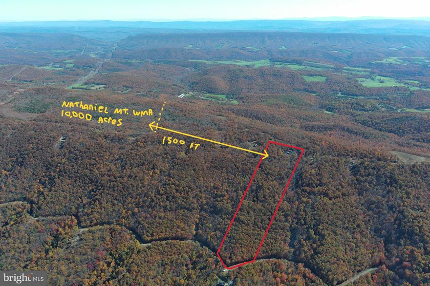 ROCK ON......20 ACRES ELEVATED AT 3000 FT ATOP SOUTH BRANCH MOUNTAIN WITH MASSIVE JAW DROPPING WESTERN VIEWS AND ONE OF THE MOST UNIQUE AND RUGGEDLY BEAUTIFUL ROCK FORMATIONS YOU'LL EVER LAY EYES ON. EASY TO BUILD ON, POWER & PERKED, SHORT DRIVEWAY & SHORT PULL FOR ELECTRIC, LOWER INFRASTRUCTURE COSTS THAN MOST LOTS TO BEGIN WITH AND THE WELL IS ALREADY DRILLED! 360 FT DEEP AND 30 GALLONS PER MINUTE! SO RIGHT THERE IS 10K YOU DON'T HAVE TO SPEND, FOR ANOTHER 20K YOU COULD BE FULLY FUNCTIONAL WITH ALL UTILTIES AND READY TO BUILD! EASY 1/4 MILE WALK TO NATHANIEL MOUNTAIN WILDLIFE MANAGEMENT AREA, WHICH IS 10,000 ACRES OF PUBLIC HUNTING LAND OWNED BY THE STATE OF WV....AND THERE ARE SEVERAL HUNDRED ACRES OF GENTLE STATE LAND ON TOP OF THE MOUNTAIN TO ROAM & HUNT THAT'S FAR FROM ANY PUBLIC ACCESS.....YOU'LL PRACTICALLY HAVE IT ALL TO YOURSELF.  IT'S WILD ON TOP OF THIS MOUNTAIN; BUCKS, BEARS & BOBCATS....OH MY! LOCATED IN THE PRESTIGIOUS 10,000 ACRE GATED COMMUNITY ASHTON WOODS, A ONE OF A KIND PLACE, WHERE YOU CAN ESCAPE THE WORK & WORRY OF THE BIG CITY AND TICKLE ALL YOUR OUTDOOR FANCIES....20 MINUTES FROM WAL MART, RESTAURANTS, 4 LANE SUPER HIGHWAY AND MULTIPLE PUBLIC ACCESS POINTS ON THE SOUTH BRANCH OF THE POTOMAC RIVER, 45 MINUTES FROM SKI RESORTS AND AN EASY 2 HOUR DRIVE FROM NORTHERN VIRGINIA. IF YOU LIKE THE OUTDOORS, YOU'LL NEVER GET BORED. TO SAY PROPERTIES LIKE THIS ARE RARE, WOULD BE A GROSS UNDERSTATEMENT....IF YOU LIKE LIVING YOUR LIFE ON TOP AND LOOKING DOWN ON CREATION....YOU'LL FEEL RIGHT AT HOME!