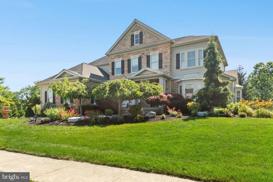 Built as the model home in a sought after Lehigh Valley neighborhood, this elegant colonial is distinguished by luxury upgrades, exceptional appointments, soaring ceilings, and ample space for multi-generational living. Over 5,900 square feet of living space on three levels encompasses 6 bedrooms and 4.5 bathrooms. A symphony of arches and architectural elements welcome you in the two story foyer which is flanked by a classic living room and expansive dining room with raised panel accent wall. Hardwood floors flow into a voluminous great room that is pure drama with massive stone floor-to-cathedral-ceiling fireplace, and oversized 2025 chandelier. An adjacent luxury kitchen is impeccably designed with granite counters, high-end stainless appliances, and island seating. The breakfast room captures the morning sun with walls of windows and vaulted ceiling. A convenient first floor bedroom with ensuite bath also enjoys the high ceilings, extra-tall wood doors, and hardwood floors found throughout the first floor.  

Indulge yourself in the comfort and splendor of the primary suite with coffered ceiling, sitting room, fabulous dual walk-in closets, and marble bath. Three additional bedrooms and a full bath complete the 2nd level. The windowed lower level offers an accommodating living space perfect for in-laws, grown children, and au pairs. A private entrance from the drive leads to a large living room, kitchen, bedroom, full bath, and office area.  

Not to be outdone by the notable interior, the premium one acre lot offers sweeping green lawns with plenty of room for sports and a substantial Trex deck. Set in an enclave of luxury homes on generous lots with sidewalks, quiet roads, and a nearby park, and conveniently located within minutes of Route 22 and 78.
