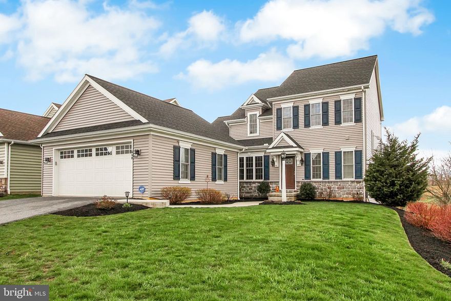 You'll love the scenic views from the deck and patio of this like-new former Parade home in Wetherburn Commons. You'll appreciate the attention to detail throughout, including crown molding, hardwood floors and granite counters in the designer kitchen and in all bathrooms. Spread out in the generous loft and walk-out finished basement. Enjoy the fitness trail and neighborhood shopping and dining.