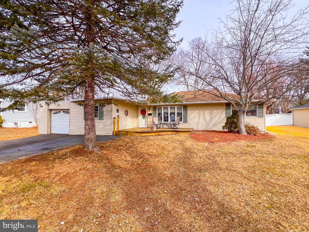 Welcome to this three bedroom expanded rancher in the Hallowell neighborhood of the Hatboro-Horsham School District. This home boasts an added large, light filled family room complete with a fireplace and full bath. So many options for this room, perhaps an in law suite, with the full bath connected. In addition to the three bedrooms, you'll find the living room with a wood burning stove, kitchen and separate dining room. The utility/storage/mud room can have many uses as well. In addition to the extra storage cabinets it provides, this could be a play area, office area, etc. The attached garage has interior access to the house. Access the spacious backyard and deck from the family room through the French doors or the kitchen door. The inviting backyard with a deck for entertaining and grilling will be sure to please. Pull down stairs to the attic for more storage is located in the bedroom hallway. This neighborhood is close to many amenities, shopping, parks, entertainment and more, while maintaining the neighborhood feel away from the hustle and bustle. Heater/AC 2021, water heater 2023. Anderson windows. Make your appointment today, will not last long!