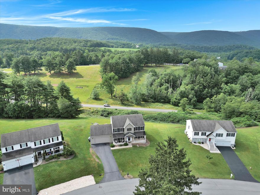 STATELY BUILD on a quiet cul-de-sac.. this 12 year new home boasts OPEN living spaces. The 2 Story Foyer greets you and leads into a  Spacious  Living Room which flows into the Family Room  with PROPANE FIREPLACE  ..  Adjacent Breakfast Area extends  to Modern Kitchen , this  opens to a Deck with a Panoramic View of the former Country Club Golf Course  ..Charming  Dedicated Formal Dining Room .. Plus  POWDER ROOM  on Main Level.. Adorable Covered Porch completes the Main Floor. 
2nd Floor MASTER SUITE  showcases the Walk In Closet  plus of course  On Suite Bath. Complemented with  2 additional Bedrooms with another Full Bathroom. Basement features  generously 12' x 30'  sized  Room displaying   a Full Size window for access and the great Natural  Light.. this room may be used as another Living Space-Office-Bar Room-Bedroom.. Buyers Choice ! The addtiional basement can be used for storage or converted as needed.