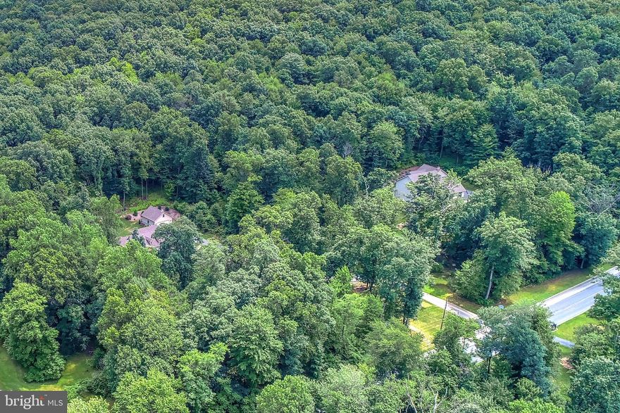 Gorgeous 13.85 acre wooded building lot in Heritage Woods. Lots range from 3-16 acres. Bring your own builder or use our builder. The community has minimal covenants/restrictions-enough to protect, but perfect for the hobbyist. Located 1 mile to river and 2 miles to RT 30, Hellam Exit. Lot sets back off main road, has well, and 100' of paved driveway.