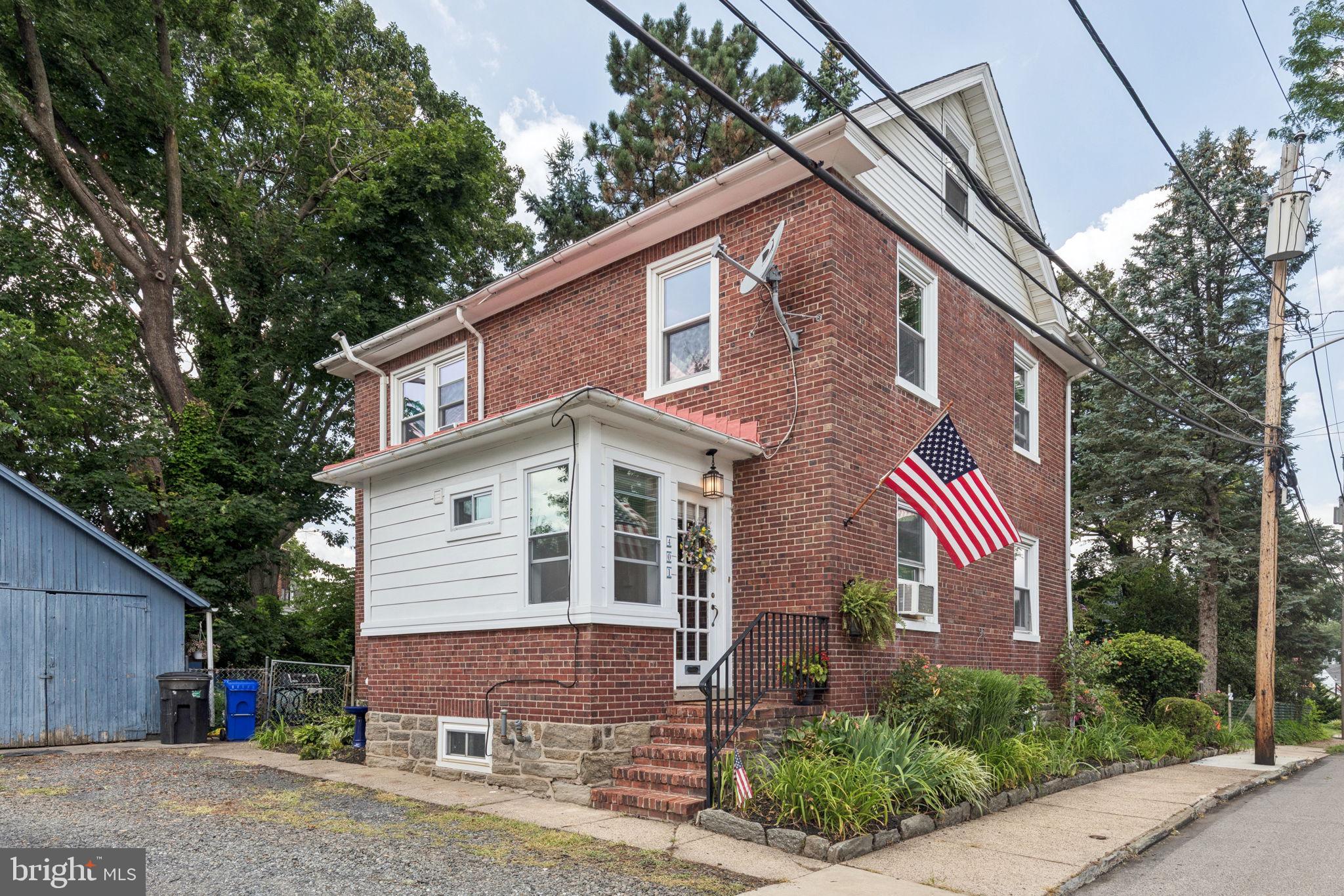 A touch of charm awaits a new Owner...This charming Single Colonial in the Heart of Jenkintown has old world appeal. Built back in 1934 this beautiful Home has so much potential....Enter the front door and step into the vestibule. Once inside you'll notice a first floor full bathroom. with stunning blue tile floor, a glass-walled shower with dual shower heads, glass doors and built in shelving. Just beyond the foyer is the spacious, bright and airy living room with full brick wood burning fireplace and custom book shelves on each side,. An added bonus are the lovely hardwood floors with walnut inlay. The huge dining room is sizeable for family events and holidays, and the hardwood flooring flows right into the dining area. Enter the Galley Kitchen through either the Dining Room or Living Room area. This bright Kitchen features quartz countertops, original to the house is the backsplash which is venetian glass, an abundance of upper and lower cabinets and an exit to the rear deck that leads down to a brick patio centered within this secluded, private and tranquil rear yard with an abundance of perennials and annuals. This is the perfect spot to relax after a long day. On the 2nd floor you'll discover three good-sized bedrooms, all boasting the same beautiful hardwood floors along wit a cedar closet and linen closet. The primary bedroom features a door that leads to a full attic, offering excellent storage space or the potential to become a den, or additional bedrooms. The full basement features the laundry area, utility room for the heater, electrical box and walk out to the rear yard. Outside there's a shared driveway and a detached shed for storage. This marvelous home is in a prime location within walking distance to Jenkintown, Schools, Churches. Close proximity to public transportation and much more. This house is a Winner - Brand new roof installed 7/29/25. Central air can be easily added as the duct work is all in place!!!