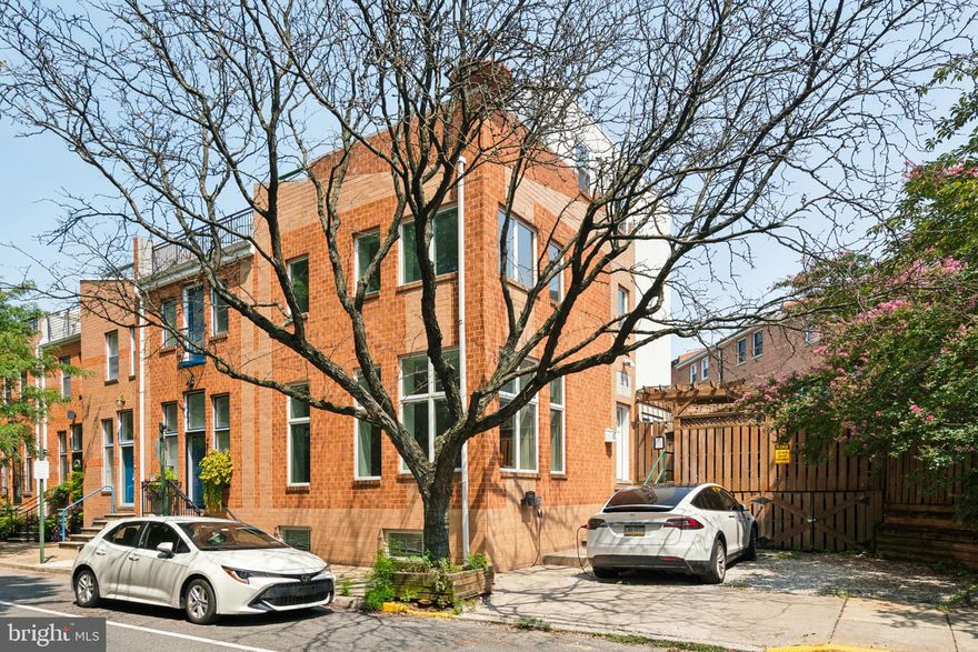 Unmissable Opportunity! This exceptional, extra-wide corner home is flooded with natural light from three exposures and features TWO CAR PARKING, complete with a Tesla charging station on site! Extensively renovated in 2015, the open floor plan showcases a newer kitchen with semi-custom cabinets and quartzite countertops, a new master bathroom, and a recently installed lighting package featuring recessed LED lighting throughout, as well as numerous new Anderson 400 series windows and a front door.

Nestled amidst the lush greenery of Fairmount Park and mere steps from the Art Museum, this stunning home is positioned alongside the park, offering expansive windows that flood the interior with natural light and provide breathtaking park views.

The residence is adorned with hardwood floors, a delightful backyard that wraps around the side and rear of the house, capacious living areas, large and luminous windows, a charming fireplace, and a finished basement with a fully renovated new bathroom.

On the second floor, you'll find two exceptionally spacious and sunlit bedrooms with ample closet space, along with a delightful hall bath featuring a tub. The magnificent full third-floor master bedroom suite showcases a generously sized walk-in closet and a recently renovated spa bathroom with a double vanity and a beautifully tiled shower. French doors open to a deck with stunning skyline and treetop views.

The fully finished basement offers versatile use as a gym, office, or potential extra bedroom, along with a laundry room and abundant storage space. Two-car parking is conveniently located directly adjacent to the front of the house, with a private entrance on the side. With convenient access to Kelly Drive, as well as local coffee shops, bars, restaurants, and Center City, the Art Museum area presents a unique opportunity to reside in a vibrant community with ample green space at the heart of the city!