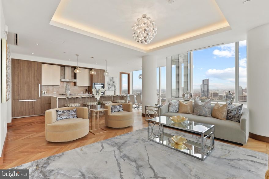 Breathtaking Panoramic views of the Inner Harbor from the most Luxurious Building, located in the most coveted Zip Code in Baltimore City, the Four Seasons Private Residences in Harbor East. This 2 Bedroom 2 Bathroom Residence, located on the 24th Floor, features an inviting Open Floor Plan with sprawling Chevron Walnut Wood Floors throughout and floor to ceiling windows in every room to ensure maximum exposure to sunlight and gorgeous views. The Custom gourmet Kitchen is perfectly appointed with Miele appliances and centered around an elegant waterfall marble countertop island that is open to the living space which includes an outdoor Patio where the dramatic views continue. The Primary suite is complete with dressing room and lavish en-suite marble bath w/ large walk-in shower and stand-alone soaking tub. Four Seasons 5-Star Amenities include a Residence Only front entrance and resident only amenities level which encompasses the entire 28th floor and the views continue. This private resident level includes an infinity edged Salt Water indoor heated pool with an open air rooftop Sundeck, a Sauna - complete with its own Harbor Views, fitness room, a large gathering and event space which consists of large dining area, lounge spaces, conference room, billiard area, kitchen space, indoor and outdoor fireplaces, multiple outdoor seating spaces, outdoor grilling area, and an outdoor AstroTurf dog walking space. Four Seasons Private Residences Baltimore, a seamless blend of sophisticated style, lavish amenities, and the exemplary service of the world's preeminent hotelier.