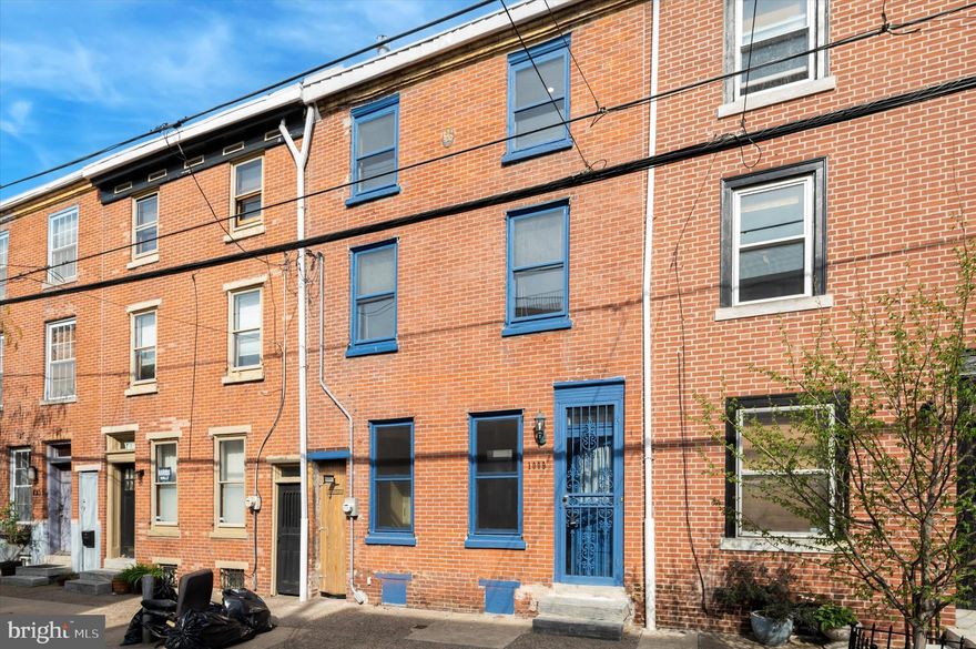 Welcome to your quintessential Northern Liberties rowhome—where historic charm meets everyday comfort in one of Philadelphia’s most vibrant and walkable neighborhoods. Perfect for first-time buyers, this home offers character, space to grow, and a lifestyle that’s hard to beat. Step inside to discover beautifully refinished, original hardwood floors, classic decorative mantels, and rich architectural details that create a warm and welcoming vibe. With separate living and dining areas, there's ample space to relax, host friends, and create lasting memories. The dining room even features a built-in wet bar—ideal for dinner parties or cozy nights in. The spacious kitchen is fully equipped with a brand-new dishwasher, a stainless steel French door refrigerator with an ice and water dispenser, and ample cabinet and counter space. Whether you’re meal prepping or ordering in, this kitchen has your back. Just off the kitchen, a bonus side room offers a flexible space for hobbies, a workshop, or a future dream pantry. Step outside to a surprisingly large backyard—not your average city yard. Think fire pit nights, backyard brunches, or even a garden. It’s your own little oasis in the city. Upstairs, a sunny second-floor den provides the perfect flex space—ideal for a home office, playroom, or reading nook. The spacious bathroom is ready for your personal touch and even has the potential to connect laundry to the second floor for added convenience. Need more space? The freshly upgraded basement is a hidden gem—perfect for a home gym, music room, storage, or laundry setup. It’s a blank canvas for whatever you need. Location Perks You'll Love: 10-minute walk to the Market-Frankford Line at Front & Girard; Acme Supermarket right around the corner; Stroll to Liberty Lands Park, Orianna Hill Dog Park, playgrounds, cafes, shops, and award-winning restaurants; Easy commute with I-95 and I-676 just 7 minutes away; Whether you're dreaming of your first home or simply looking for a smart step into one of Philly’s most exciting neighborhoods, this home offers the perfect mix of charm, function, and potential. Start your next chapter here—welcome home.
