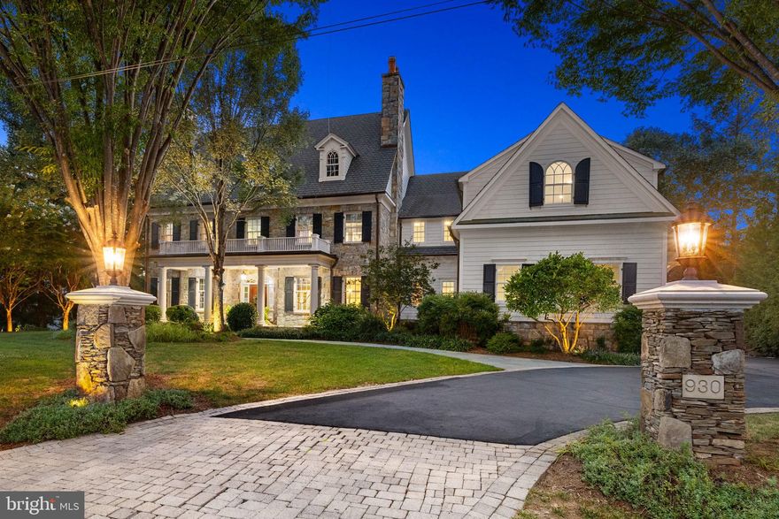 A rare opportunity to own an estate of timeless beauty, crafted with exceptional quality and elevated by a resort-caliber backyard that offers an incomparable lifestyle just moments from the nation’s capital. Nestled on a lushly landscaped one-acre lot in sought-after Langley Forest, this extraordinary custom home by Galileo Builders spans more than 10,000 square feet and showcases 7 bedrooms, 8 bathrooms, 4 fireplaces, and a screened porch.

The spectacular backyard is a private oasis designed for year-round enjoyment. At its center is a sparkling pool and spa, complemented by a pergola with a full outdoor kitchen, a pavilion with a ceiling-mounted TV and electronic shade screen, a dramatic stone fireplace, and expansive terraces surrounded by manicured gardens.

Inside, timeless architecture and bespoke finishes create an elegant yet welcoming ambiance, with a seamless flow between indoor and outdoor spaces. The grand foyer opens to light-filled interiors with 10-foot ceilings and gracious formal rooms: a living room with marble fireplace, a banquet-sized dining room with butler’s pantry, and a richly appointed library with custom built-ins and hidden bar. The family room, anchored by a large stone fireplace, connects to the chef’s kitchen outfitted with professional-grade appliances, a walk-in pantry, and a secondary butler’s pantry with wet bar. The breakfast room, framed by walls of windows overlooking the grounds, features a coffered ceiling and serene vistas. A screened porch with skylights, mudroom, and three-car garage complete the main level.

Upstairs, the owner’s suite is a private retreat with a vestibule entry, tray ceiling with accent lighting, an expansive custom walk-in closet with dressing room, and a spa-inspired bath with dual vanities and soaking tub. Four additional bedrooms, a large exercise room, and a laundry room complete the upper level.

The walkout lower level is designed for both recreation and hospitality. Highlights include a lounge with bar, recreation and media rooms, a custom wine cellar, and a guest/in-law suite with living area, kitchenette, and two ensuite bedrooms. A changing room and second laundry enhance convenience, while direct access to the terraces ensures effortless indoor-outdoor entertaining.