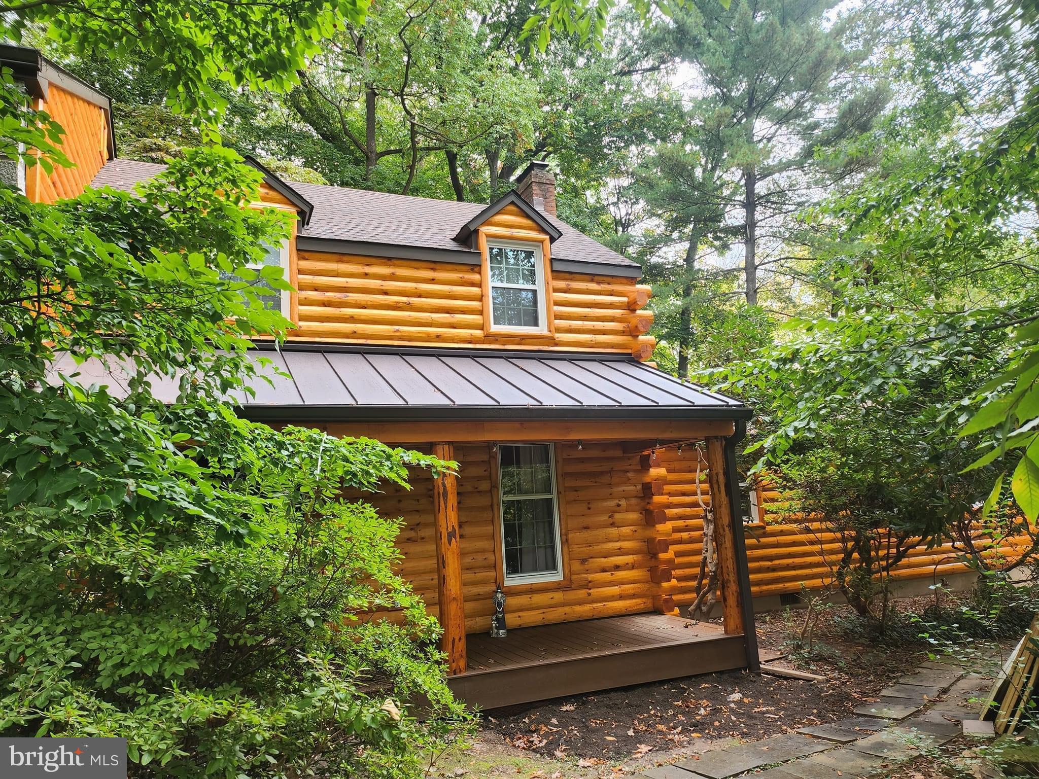 WOW!! This Log Home is Gorgeous. In a secluded neighborhood with a natural setting. As you enter from the front porch (trex) into the foyer which has beautiful slate flooring, look to your left at a spacious living room with large windows for plenty of light, Built-in shelving. To your right is a lovely family room, picturesque window and a wood stove for warm cozy nights. Enter into the Kitchen which has beautiful cherry cabinets, ceramic tile and newer appliances. Next, is the sizable dining area off kitchen for many family dinners and celebrations! Entire main level has stunning hardwood flooring and fresh paint. Off the family room is a mud/office/sun room, make it yours to enjoy, which has access to the splendid slate patio out back to relax and appreciate the scenery. As we continue upstairs ,walk into the Spacious Primary bedroom with a large walk- in closet and full bath, newly renovated. Continue on to 2 more large bedrooms and a full hall bath also newly updated. Hardwood flooring throughout the upstairs. This lovely home has many new features, washer, dryer, water heater, water softener.... all brand new. Full house generator, wood stove, refrigerator all included! Come out and see the Beautiful Home. Conveniently located close to town, great dining, shopping and entertainment. Sought after school district.