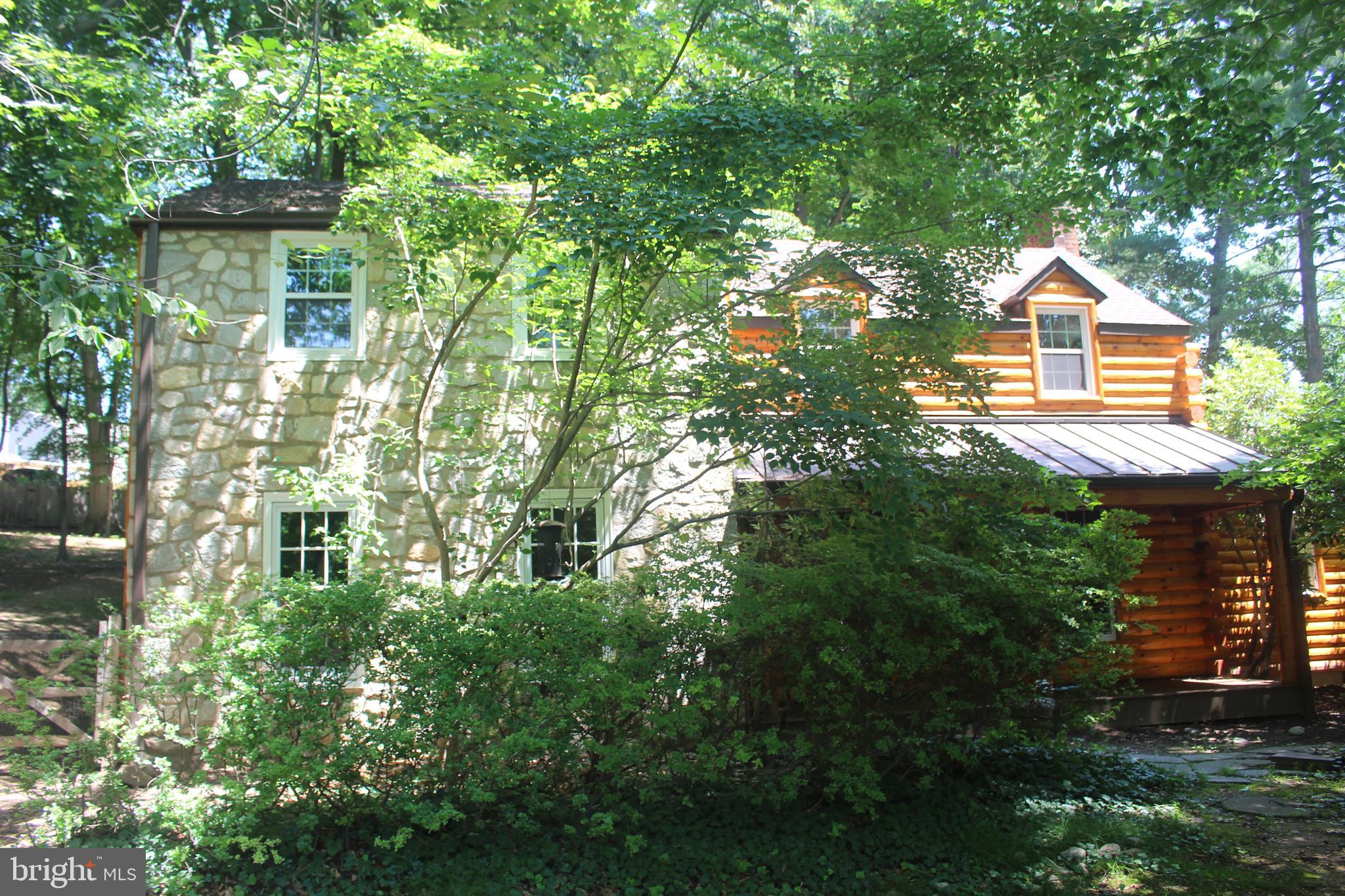 WOW!! This Log Home is Gorgeous. In a secluded neighborhood with a natural setting. As you enter from the front porch (trex) into the foyer which has beautiful slate flooring, look to your left at a spacious living room with large windows for plenty of light, Built-in shelving. To your right is a lovely family room, picturesque window and a wood stove for warm cozy nights. Enter into the Kitchen which has beautiful cherry cabinets, ceramic tile and newer appliances. Next, is the sizable dining area off kitchen for many family dinners and celebrations! Entire main level has stunning hardwood flooring and fresh paint. Off the family room is a mud/office/sun room, make it yours to enjoy, which has access to the splendid slate patio out back to relax and appreciate the scenery. As we continue upstairs ,walk into the Spacious Primary bedroom with a large walk- in closet and full bath, newly renovated. Continue on to 2 more large bedrooms and a full hall bath also newly updated. Hardwood flooring throughout the upstairs. This lovely home has many new features, washer, dryer, water heater, water softener.... all brand new. Full house generator, wood stove, refrigerator all included! Come out and see the Beautiful Home. Conveniently located close to town, great dining, shopping and entertainment. Sought after school district.