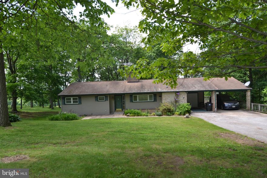 OFFER RECEIVED. Deadline for all offers will be Thursday, May 23 at 7pm.  This rancher sits on an acre of land with beautiful woods behind.  The home used to be a 3three bedroom, but the owners opened up two to make a master suite with sitting area.  Everything you need is on one level with beautiful hardwood floors in social space; bedrooms, full bath, living room, large kitchen with stainless steel appliances and laundry.  Extra fun space downstairs with good size family space, full bath, Unfinished space that would make a great workshop, separate laundry room and access to the backyard.  Central air and tankless water heater.  Home being sold AS-IS.