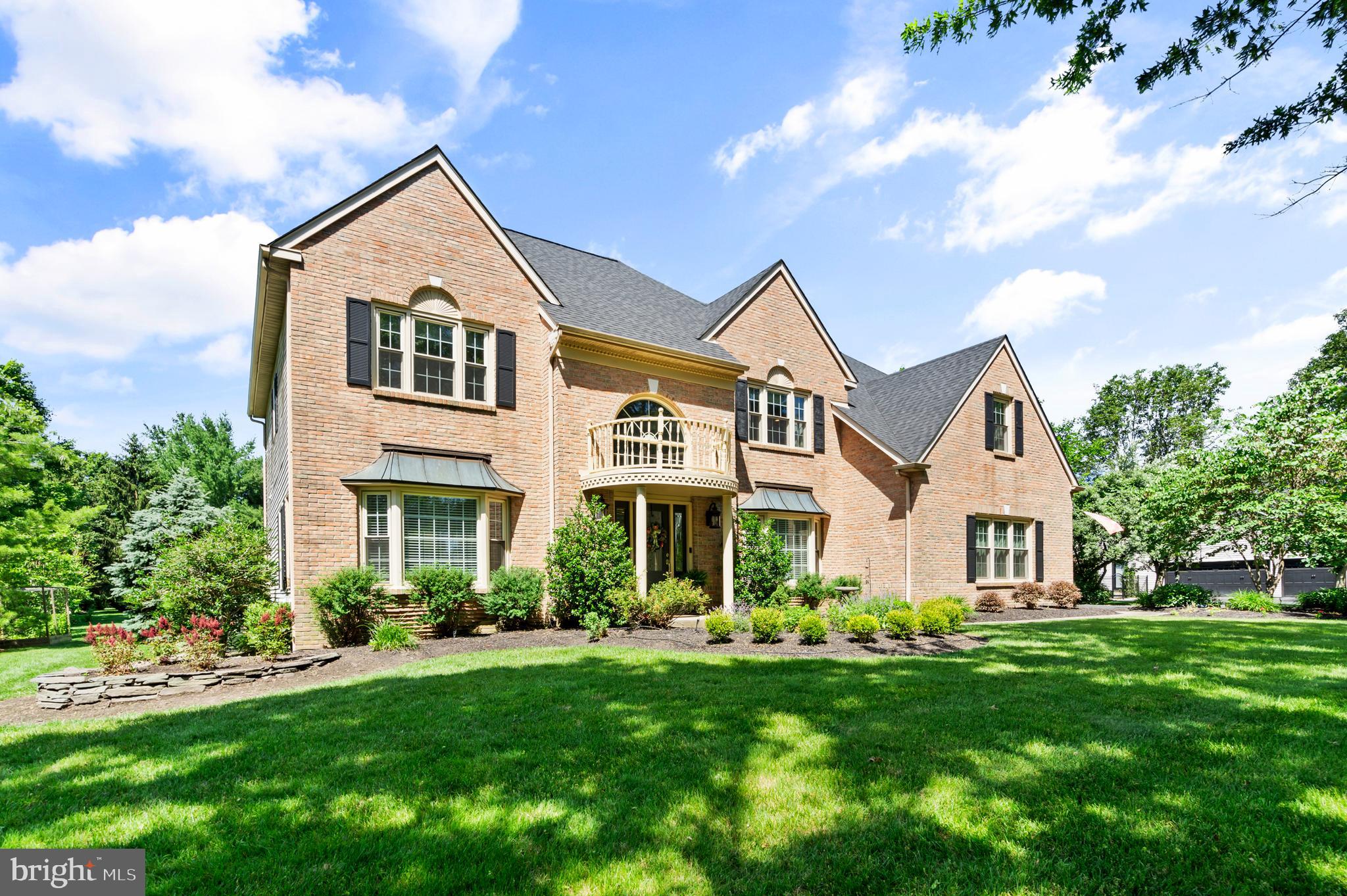Introducing 75 Bittersweet Drive, a spectacular luxury home in the heart of the coveted Doylestown Lea community in the award-winning Central Bucks School District. This immaculate, 4-bed, 4.1 bath home redefines elegance with its high-end finishes & thoughtful design. The grand foyer welcomes you with sophistication, flanked by a sleek home office to the right showcasing custom millwork & a spacious & inviting sitting room to the left that seamlessly flows into a refined dining room perfect for hosting memorable gatherings. The heart of the home is the chef’s gourmet kitchen, a culinary masterpiece featuring a large center island, quartz countertops & backsplash, top tier appliances including a Wolf 6-gas burner with oversized oven, a Viking double wall oven & a wall mounted pot-filler. Hand-crafted two-tone cabinetry with built in lighting, glass upper cabinet doors & a custom wall of windows overlooking the expansive paver patio & lush gardens provide the finishing touches. Adjacent, the sunlit eat-in breakfast area offers a cozy nook for casual dining, while the great room, with its floor-to-ceiling stone fireplace, provides a warm ambiance for relaxation. A walk-in pantry with a bespoke barn door, a convenient half bath with designer fixtures, a built-in sound system & a well-appointed laundry room with ample storage complete the main level. Ascend the grand staircase, where tranquility awaits. The primary bedroom is a serene retreat, boasting an electric fireplace & generous walk-in closets with tailored organization systems. The primary bathroom is right out of the Four Seasons with its luxurious marble surrounds, electric fireplace above a soaking jacuzzi tub, heated floors, built-in sound system, dual vanities & glass-enclosed shower. The princess suite is complete with its own ensuite bathroom & ample closet space, ideal for guests or family members seeking extra comfort. Two additional bedrooms, each thoughtfully designed with plush carpeting share a well-appointed Jack-&-Jill bathroom, featuring dual sinks & modern fixtures. The finished lower level is an entertainer’s dream, offering a versatile space for leisure & recreation. A state-of-the-art wine cellar, with custom racking holding 200+ bottles, provides the perfect environment for storing & showcasing your collection. The dedicated exercise room is ideal for fitness enthusiasts. Unwind in the media room, featuring plush seating & surround sound for an immersive cinematic experience. Pass by the floor-to-ceiling stone wall showcasing a beautiful gas fireplace as you enter into the billiards room with additional custom millwork creating an inviting atmosphere for friendly competitions. A full bathroom adds convenience & elegance to this remarkable lower level. Step outside to a meticulously landscaped English-style garden with a custom-built trellis perfect for al fresco dining or relaxing in the shade. An elegant iron fence with a graceful gate opens to a lavish rose & flower garden, bursting with vibrant blooms & fragrant blossoms. An arched double-door shed, designed with a dedicated gardening station, offers both functionality & charm for gardening enthusiasts. On the opposite side of the property, an organic raised-bed vegetable garden provides a sustainable space for cultivating fresh produce. Every detail in this home exudes quality, from the intricate millwork, wainscoting & mouldings to the advanced whole-house water filtration system & beautifully designed landscaping. Perfectly situated in one of Doylestown’s most sought-after communities, 75 Bittersweet Drive offers unparalleled access to comfort & convenience. Enjoy a short walk to Central Park, scenic trails, nearby Terrain at DelVal & the soon-to-be-completed Doylestown Township Park Improvement Project. With its prime location & exceptional features, this spectacular home offers a rare opportunity to live in luxury in one of Doylestown’s most popular communities!