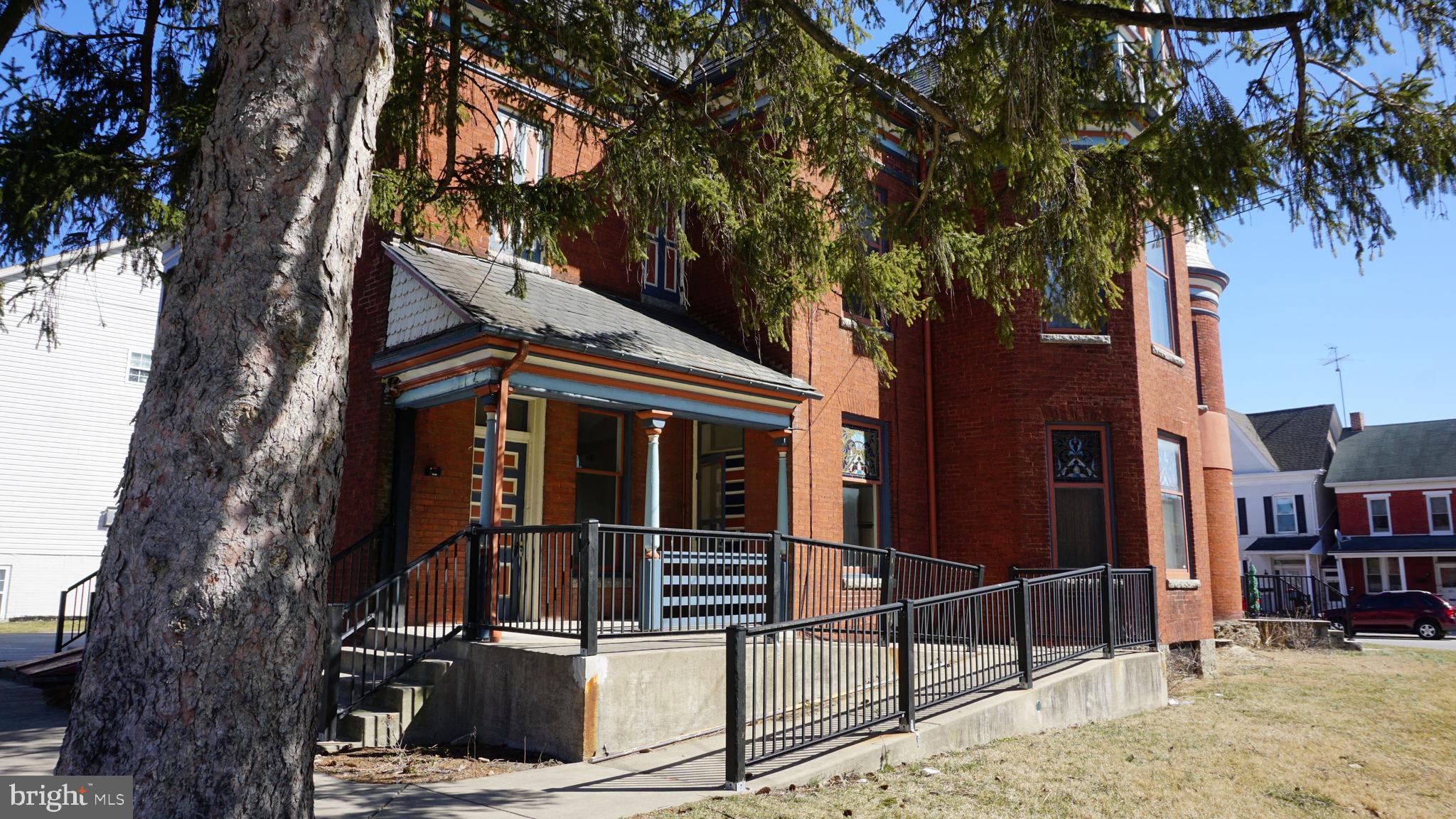 Beautiful First floor apartment in a large 4 unit historic building. This unit has high ceilings and many original features including stained glass windows. The kitchen has some updates and a new layout with lots of counter space. The bathroom is brand new. There is an in unit stacked washer and dryer. This apartment oozes with charm. There are two entrences, one from the front lobby and a private rear door. Excellent off street parking surrounds the building. This was formally a Dr's office and was built in the late 1800's to a high standard. Central air and gas heat keep the apartment comfortable year round. Why rent a dark drab apartment when you can live in a bright inviting space.