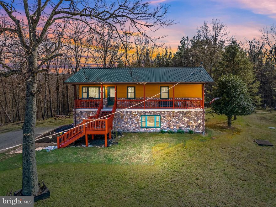 FULL-TIME or PART-TIME- take your pick, make this 4-bedroom 3- bathroom home on 2.2 acres your full-time or part-time residence. This home has the room you need for entertaining your family and friends. The main floor has 3 bedrooms & 2 bathrooms. Having a kitchen/dining/living room all together with a sliding door to the 16ft x 39ft rear deck, you have the room for entertaining you'll need. The lower level has a 4th bedroom, bathroom & large family room with an additional kitchen/dining area, or a bar if you choose. Lower level also has a pellet stove. This can be more entertaining area or a perfect in-law suite. Enjoy the outside relaxing on the covered front porch or rear deck while soaking in the Hot Tub. This property also has a small cottage that can be used as a guest quarter or just a playhouse. Also, a shed for your toys and yard equipment. You like wildlife, you'll have it. This is within 2 hours of Baltimore & DC to make the perfect getaway.