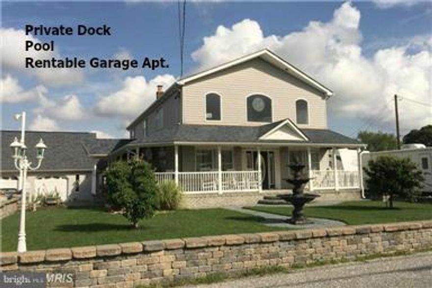 Waterfront Property with Dock- on double lot! Private pier with access in the back to the river.  Front of house opens to field. Spacious, custom home has 4 BR with sep 1 BR apartment above garage.   Relax on the front porch or entertain on the patio.  Other amenities include above ground pool, 2 car garage, and hot tub in sun room.  Pier with access to the Back River.