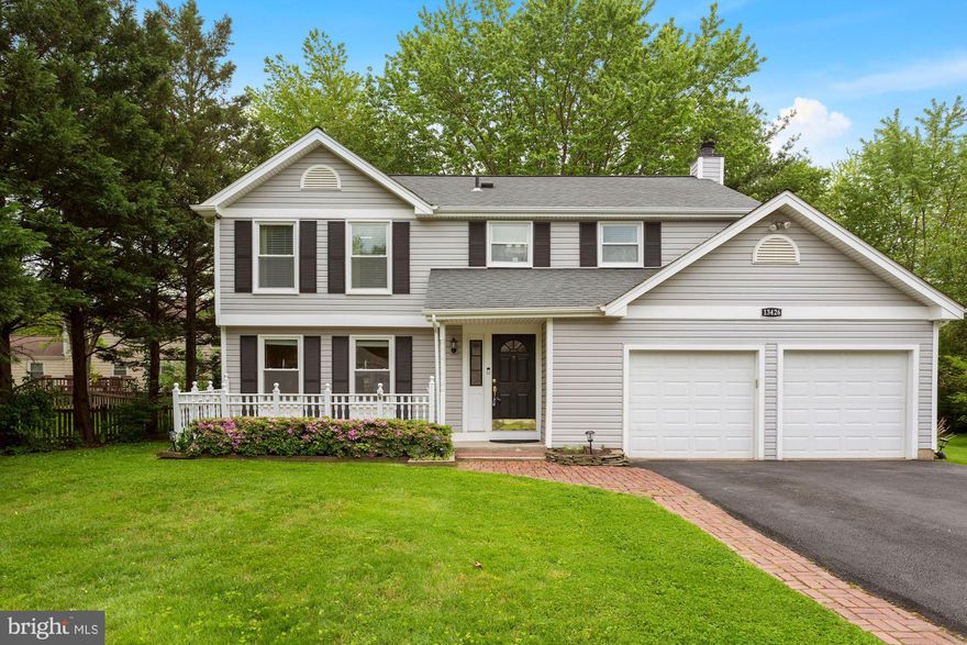 Huge price reduction! Welcome home! Enter this gem  in the heart of Franklin Farm through an expanded and bumped out foyer with extra windows and coat closet. Main level hardwoods just refinished! Brand new windows and a new slider to the deck in 2020. Staircase straight ahead takes you up to four bedrooms on upper level with 2 full renovated baths and an additional legal bedroom with egress window on lower level with option for a 6th in bonus room with secret door and private storage room. Main bedroom has cedar lined closet and additional "his" closet opening to bedroom. Full renovated bath and front loading laundry in basement. Brand new LG washer and dryer just installed!  Upgraded kitchen with granite counter tops and newer cabinets--bright and light with bay window in eat-in area. Room for chairs at kitchen counter too! Separate dining room  and two separate living spaces, one with a wood fireplace, off kitchen. Hardwood floors throughout main level.  Patio doors off kitchen lead to large deck with space for seating areas, a table and an outdoor bar,  hot tub which conveys, and access to side yard. Sellers will provide a full month of lawn care service with Santos Herrera Landscaping as a bonus for buyers.  Large 2-car attached garage and spaces in paved driveway, located at the end of the pipe stem. Special assessment pays for repaving and maintenance of pipe stem road at regular intervals.