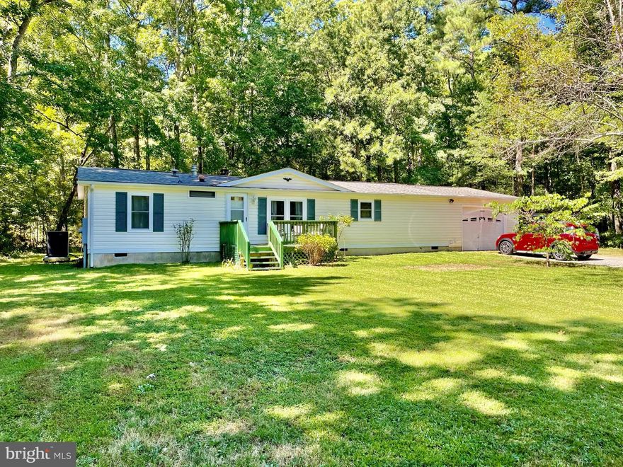 Conveniently located minutes from Piney Point Beach and  Piney Point Lighthouse Museum & Historic Park. This house features a Split Bedroom Layout, with 3 bedrooms, 2 bathrooms, new flooring throughout the spacious living area, a cozy woodburning fireplace, and a side entry into a mudroom/launtry room. The refrigerator, washer, and dryer were all replaced in 2018. Roof and HVAC were replaced in 2020. The kitchen has a coffee bar/office space and plenty of counter space. Deck was replaced last summer, and the current owner has replaced all windows throughout the home. Oversized 1 car garage will not disappoint. Call today for a showing! Lot 1902045745 (tax id) with .18 acres conveys with the property. Another plus to the property is the under  twenty minute drive to the Nas Pax River! (Acreage on listing reflects the .18 acres that will convey)